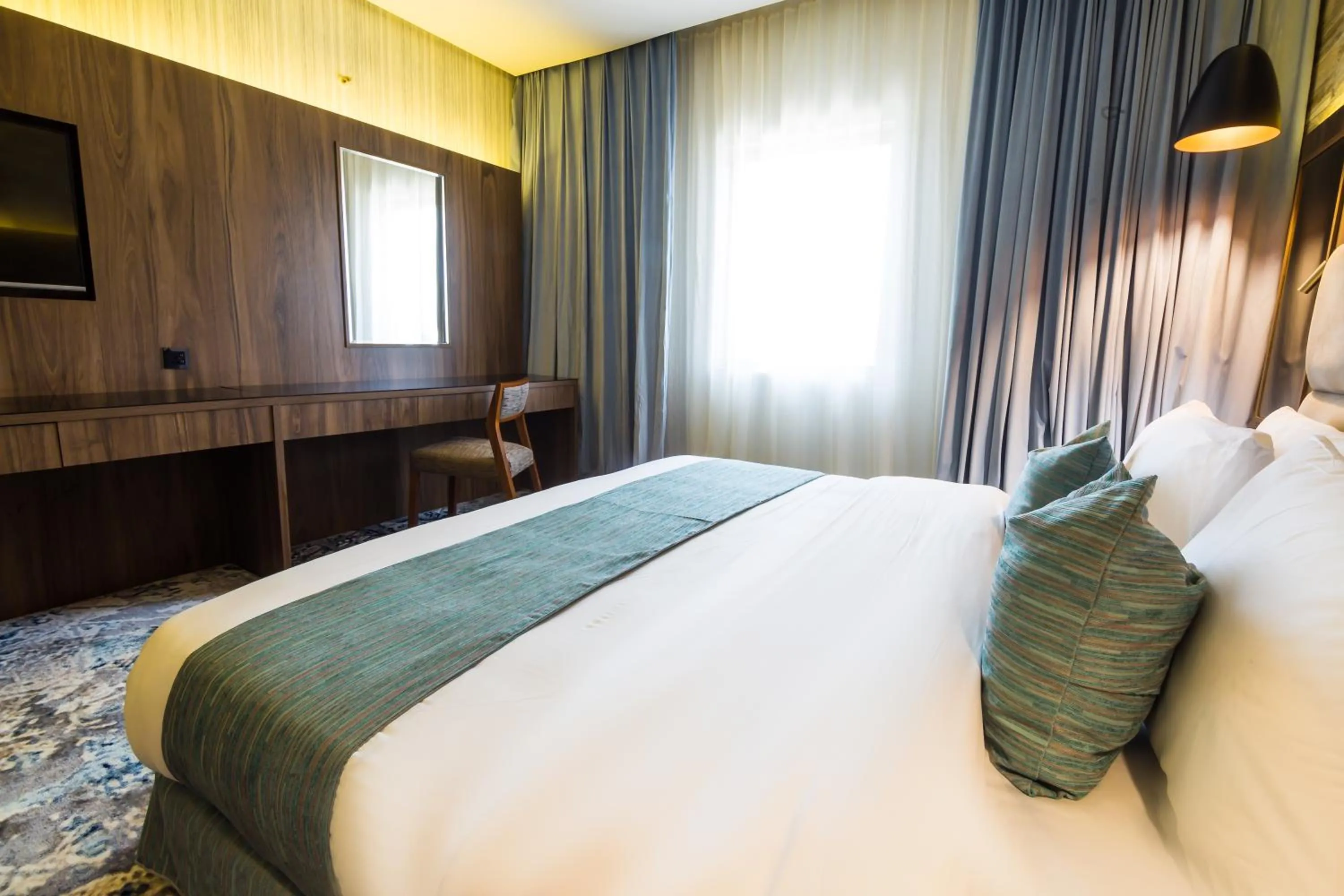 Bed in Wow Diamond Hotel