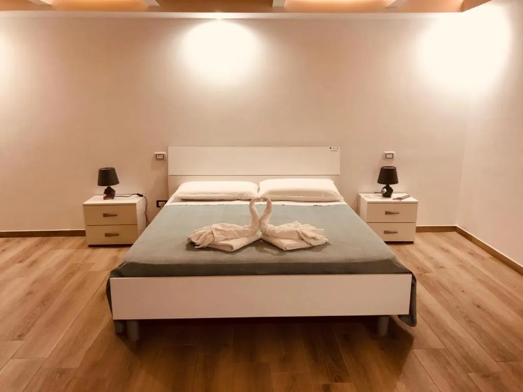 Bed in Mastropaolo42 Luxury B&B