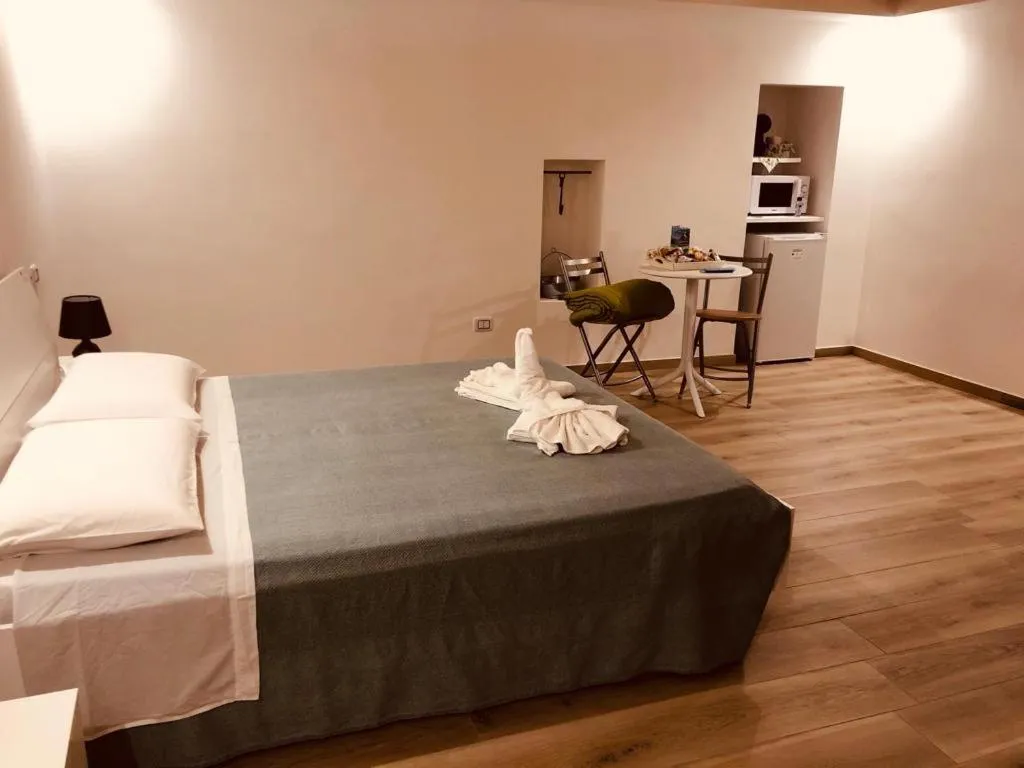 Bed in Mastropaolo42 Luxury B&B