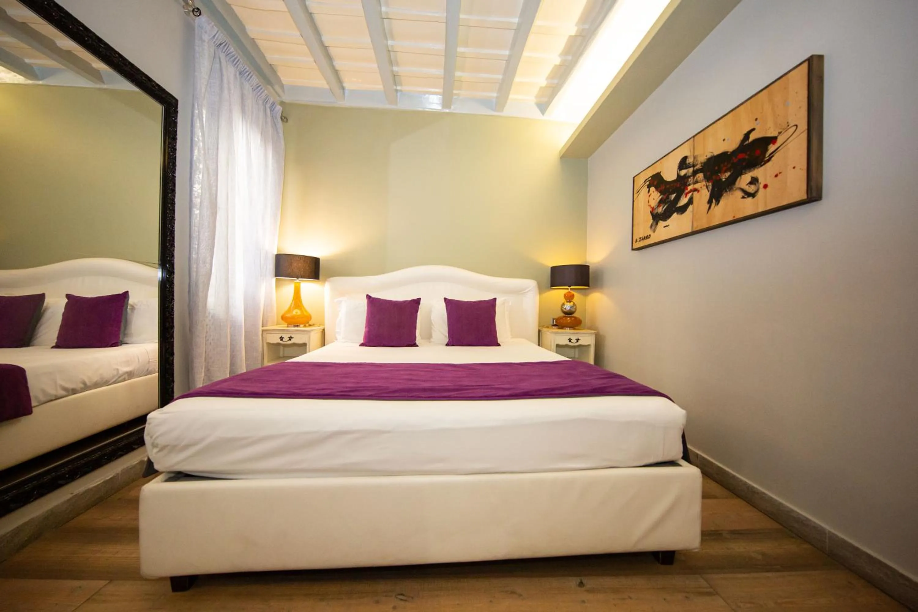 Bed in Corso Suite 107 Rooms Wellness & Spa