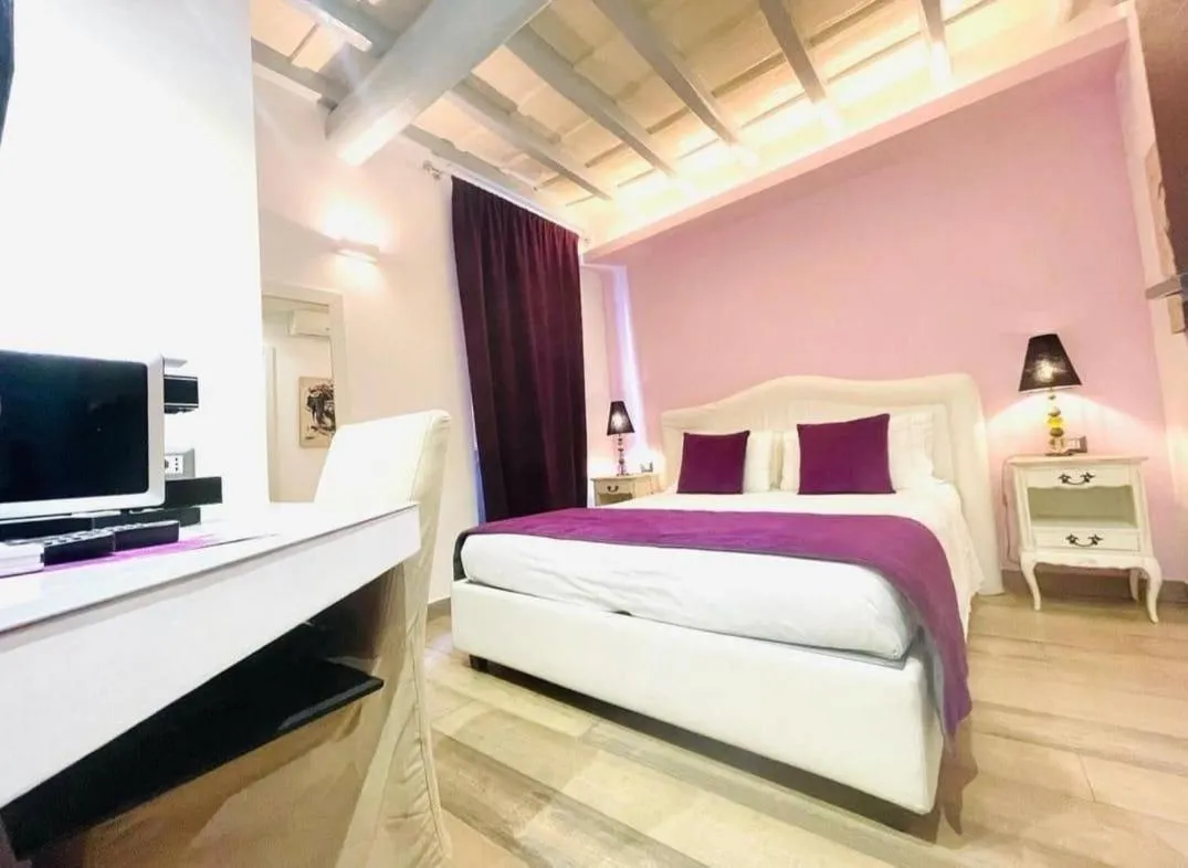 Bed in Corso Suite 107 Rooms Wellness & Spa