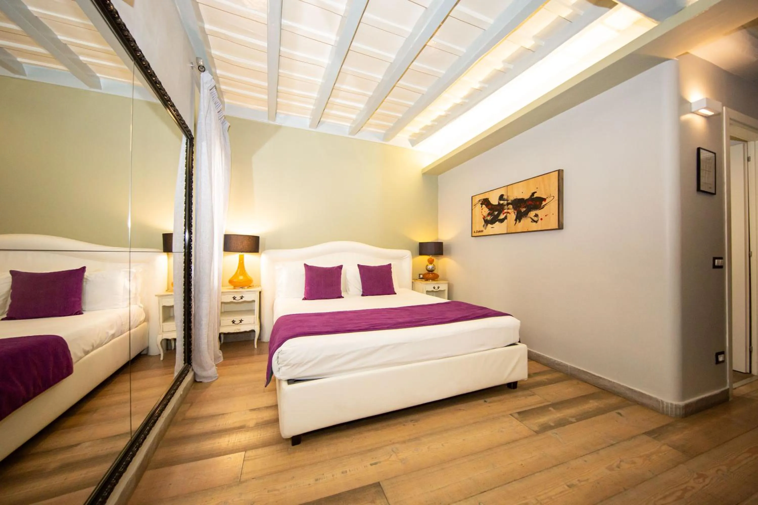 Bed in Corso Suite 107 Rooms Wellness & Spa