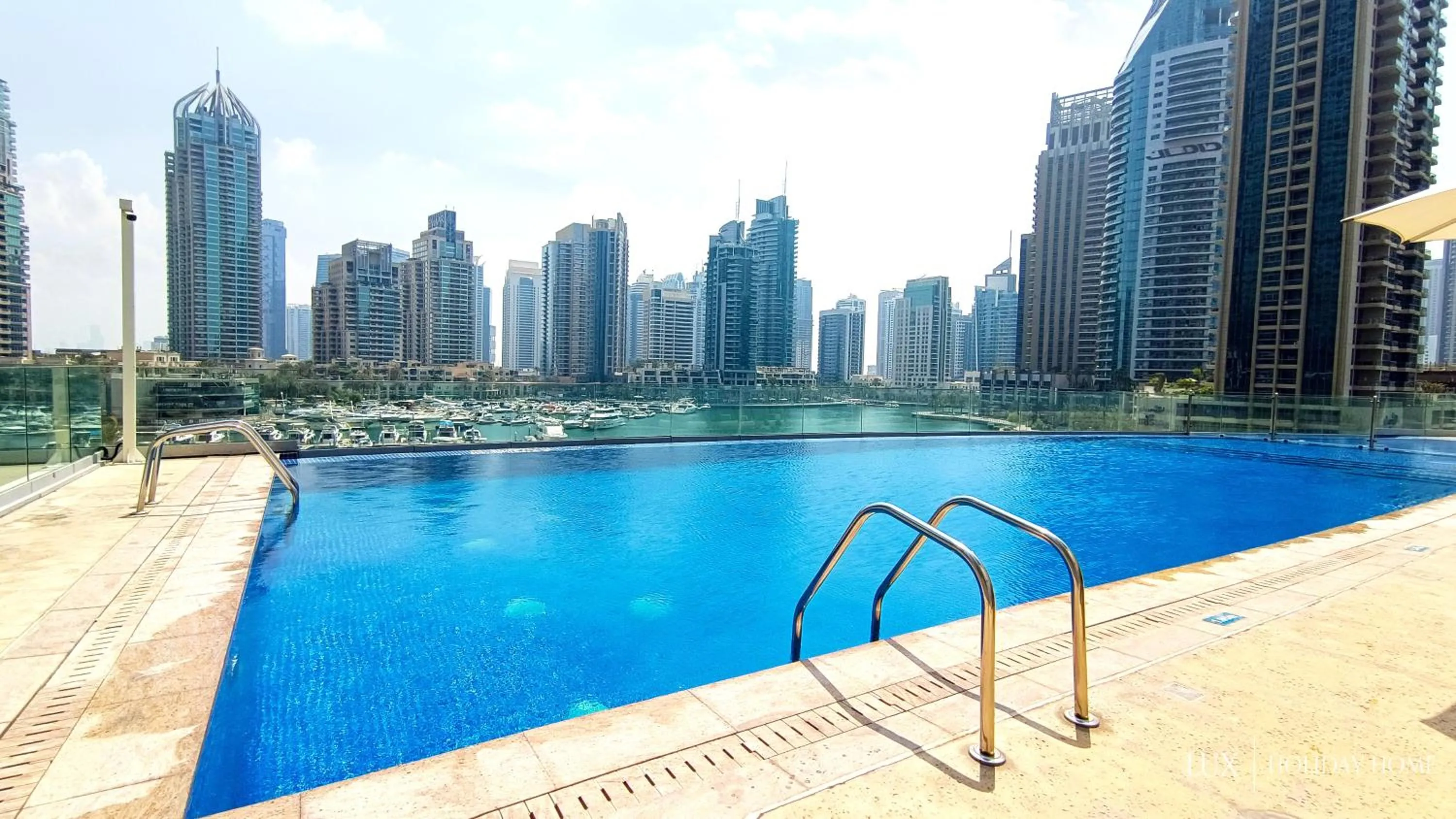 Swimming pool in LUX The Cayan Superior Suite in The Dubai Marina