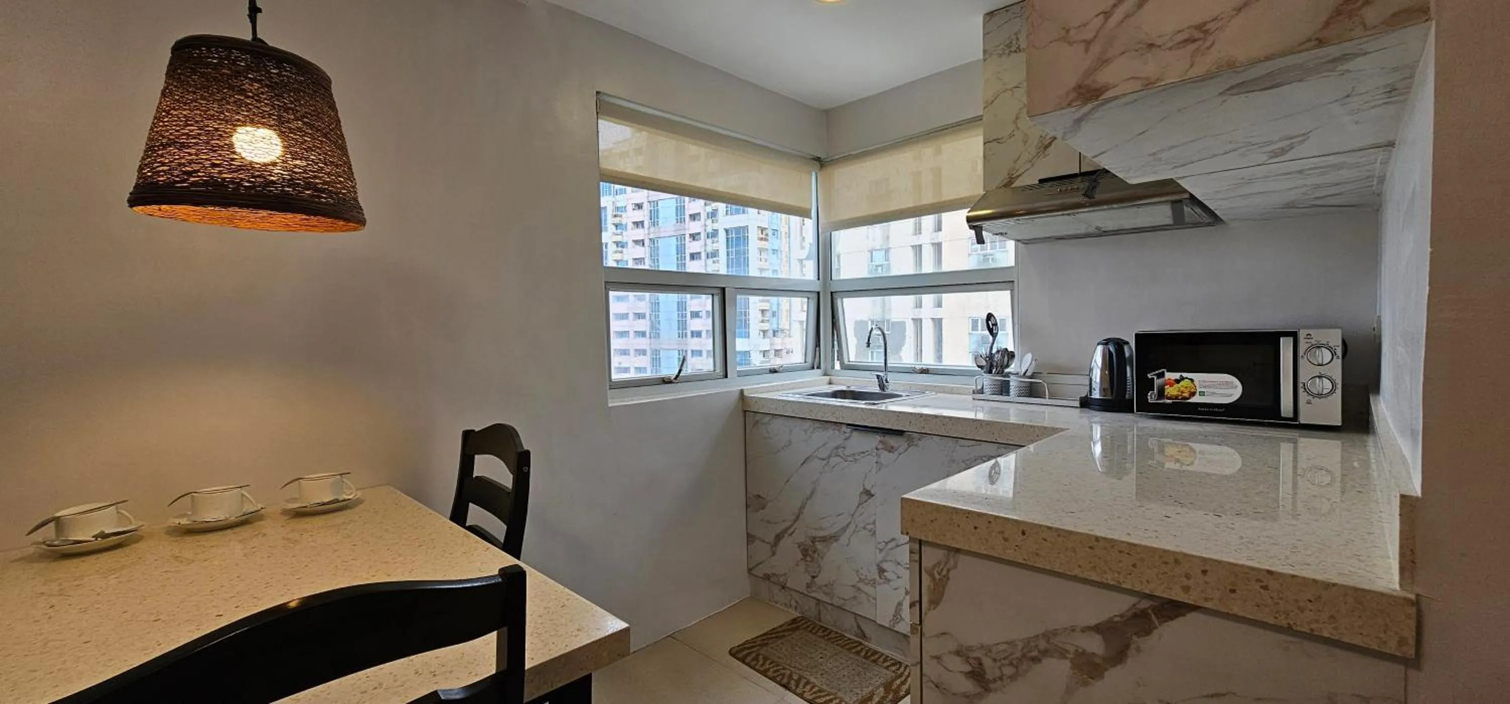 Kitchen or kitchenette in Gilmore Tower Suites By SMS Hospitality