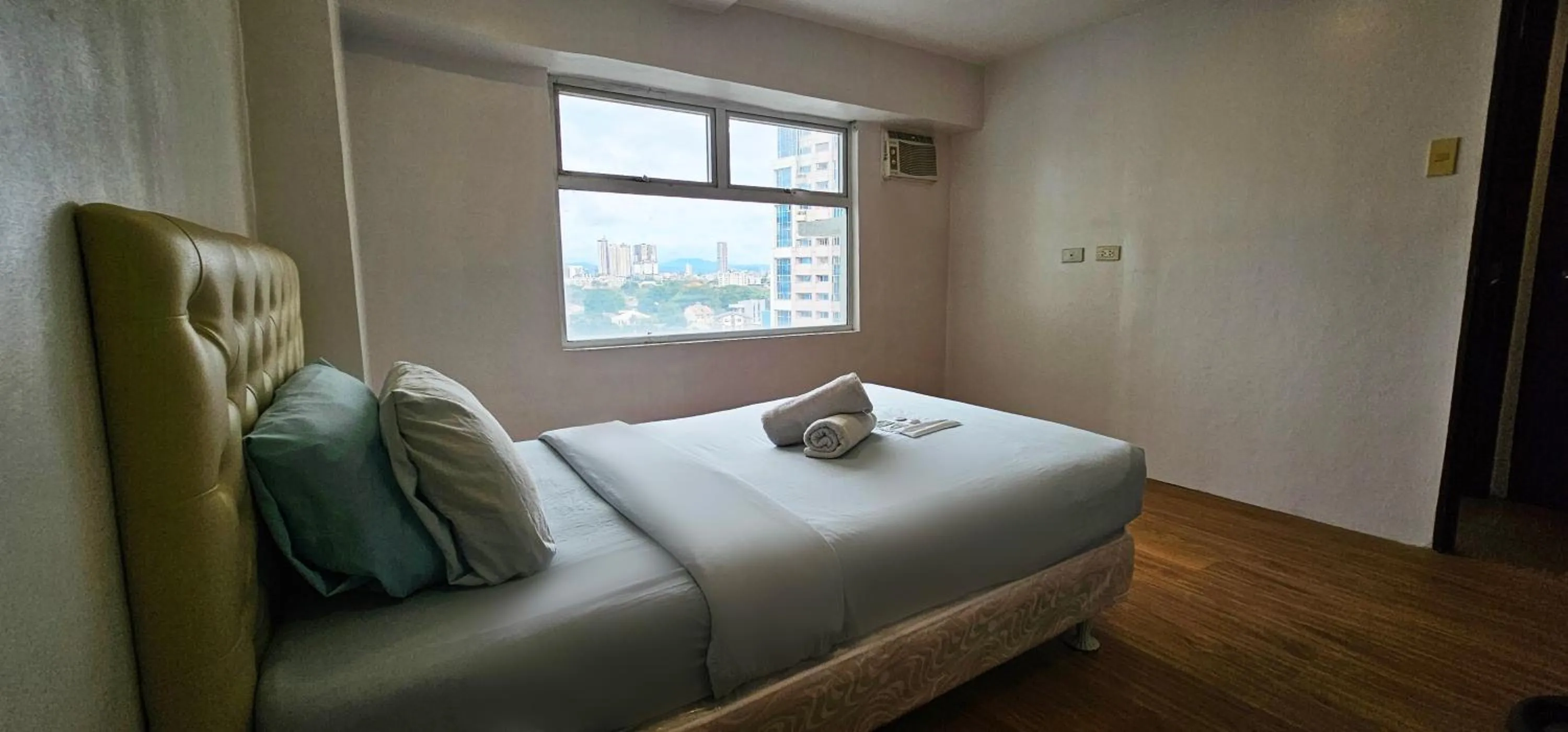 Bed in Gilmore Tower Suites By SMS Hospitality