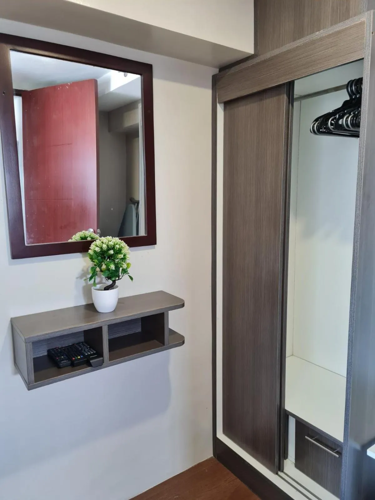 wardrobe in Gilmore Tower Suites By SMS Hospitality
