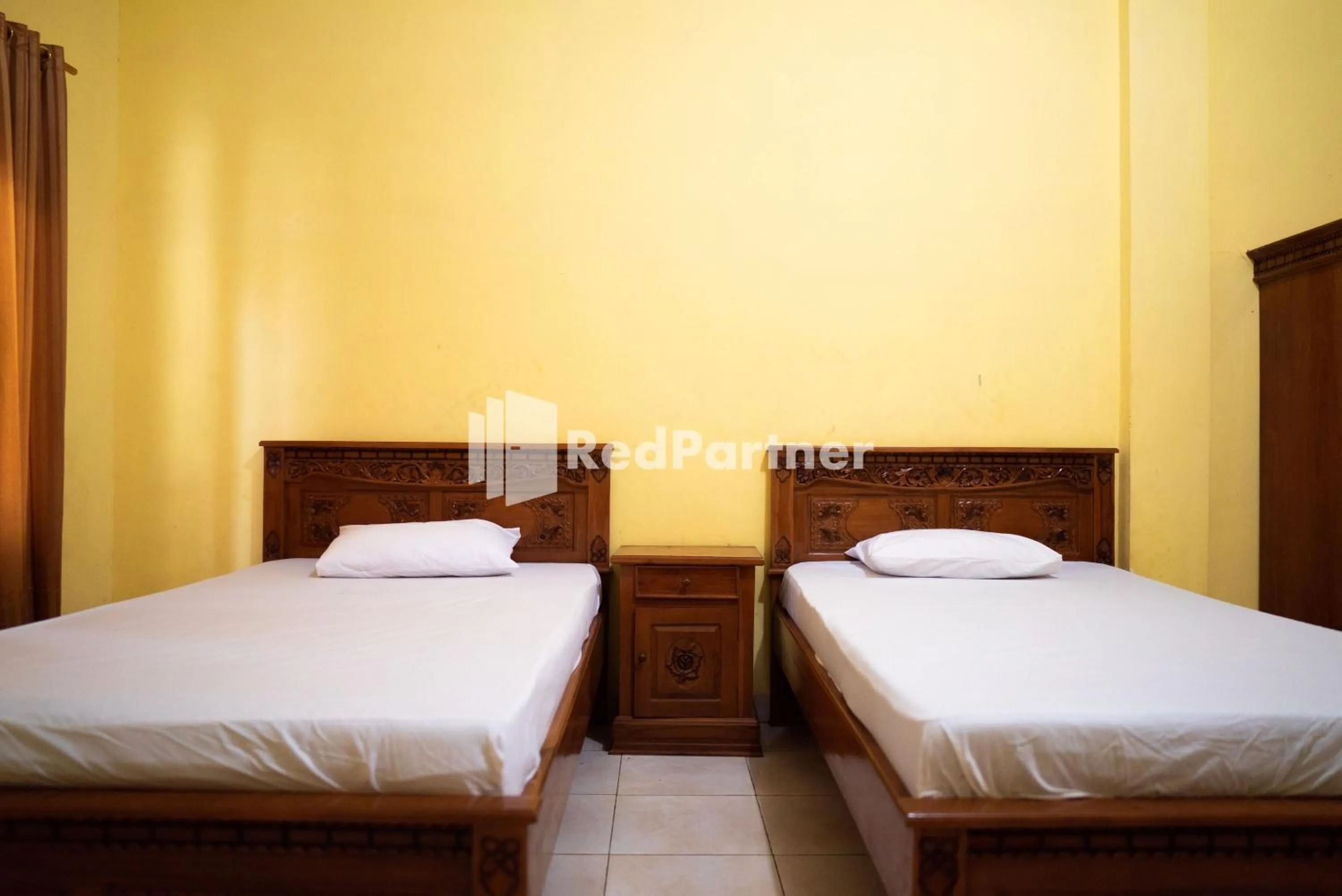 Bedroom, Bed in Wisma Citra Metro Mitra RedDoorz