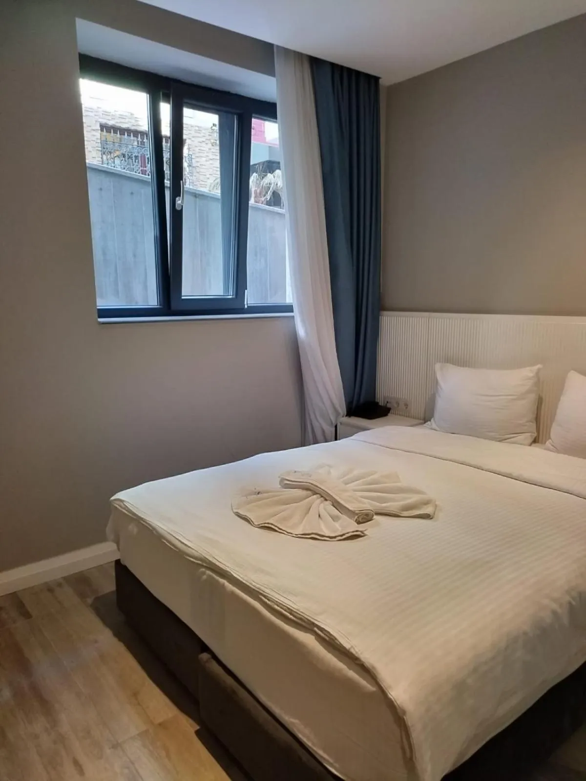 Bed in Sel Suite Hotel