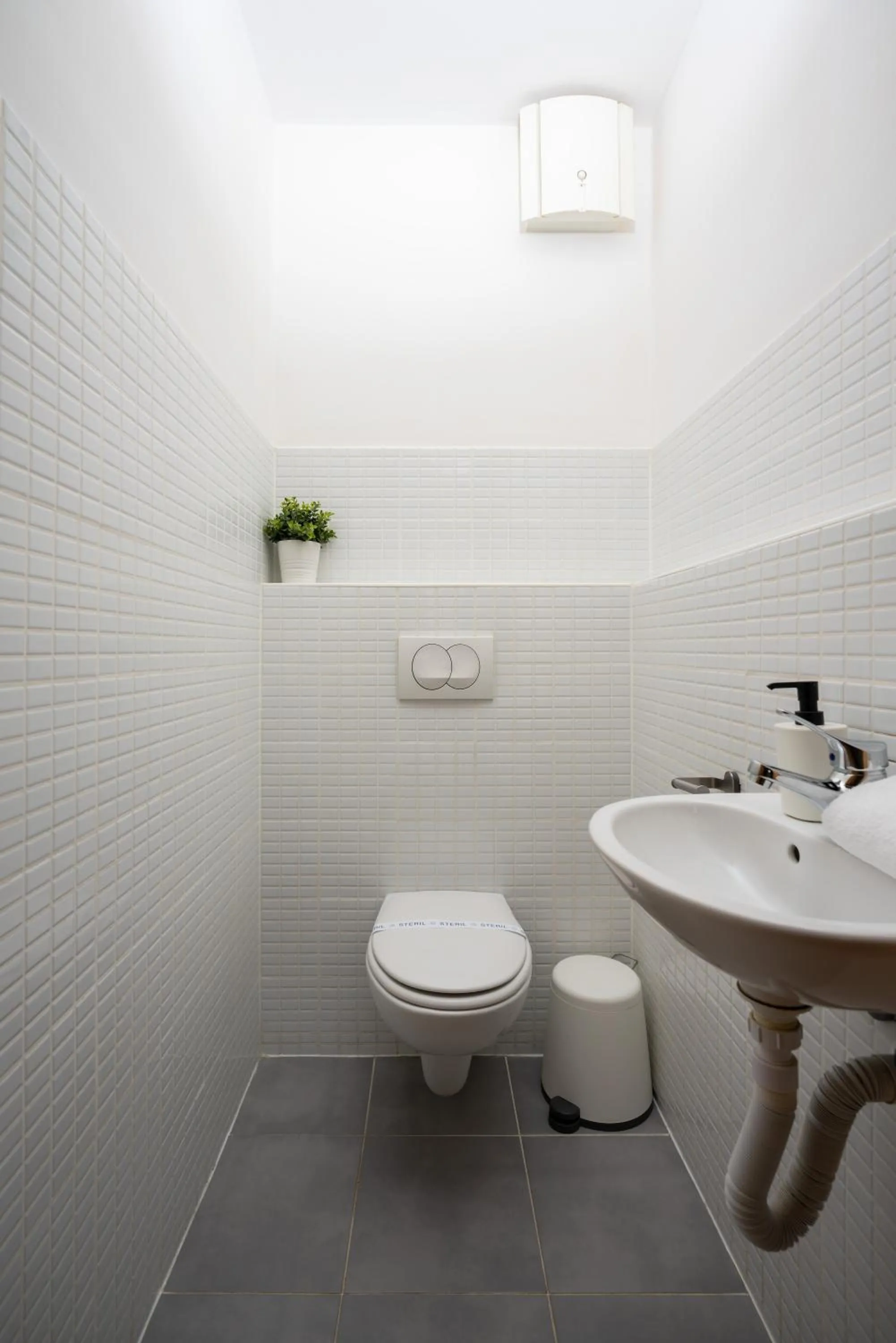 Toilet in Central Passage Apartments by Vagabond Downtown