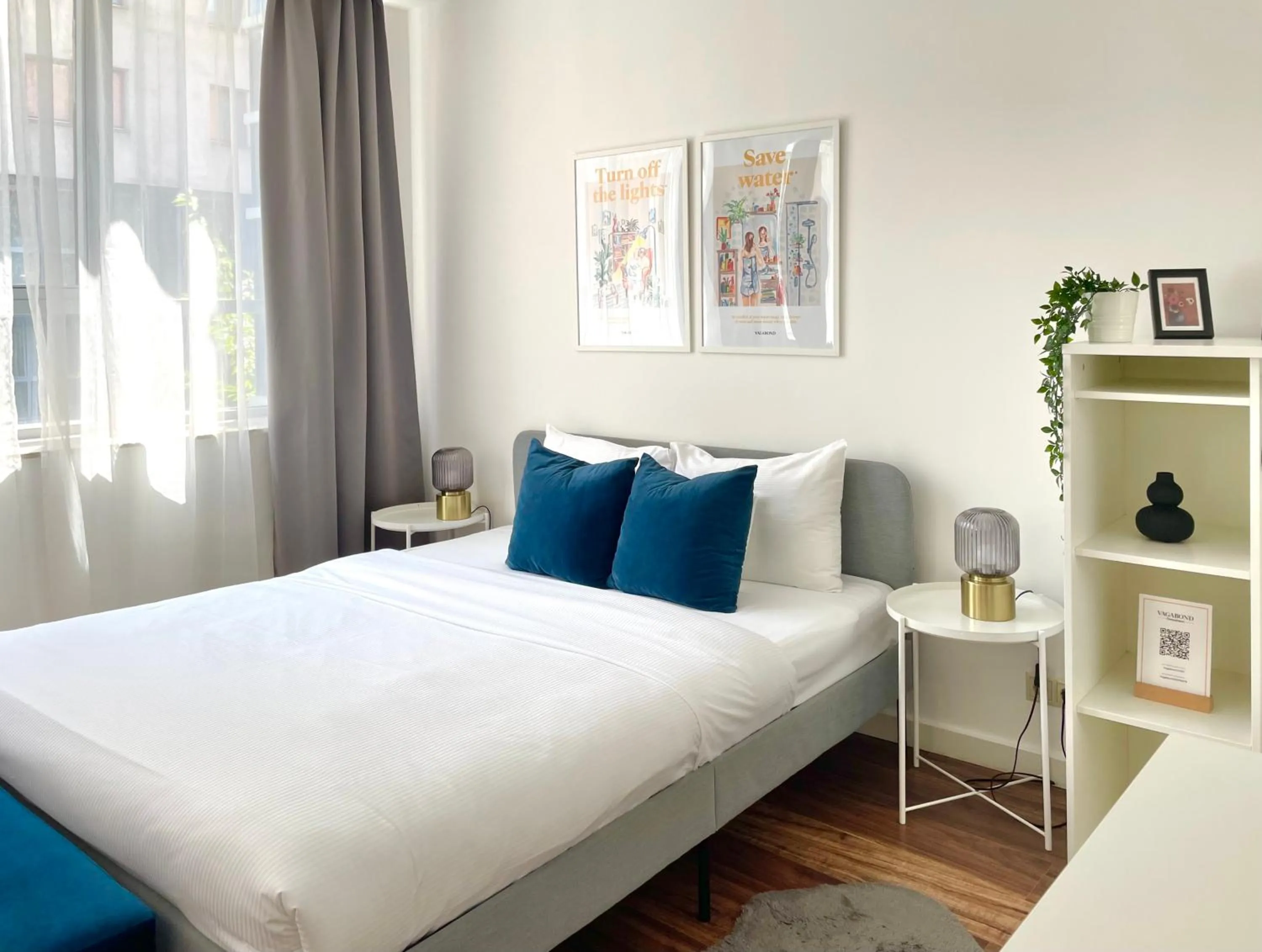 Bed in Central Passage Apartments by Vagabond Downtown