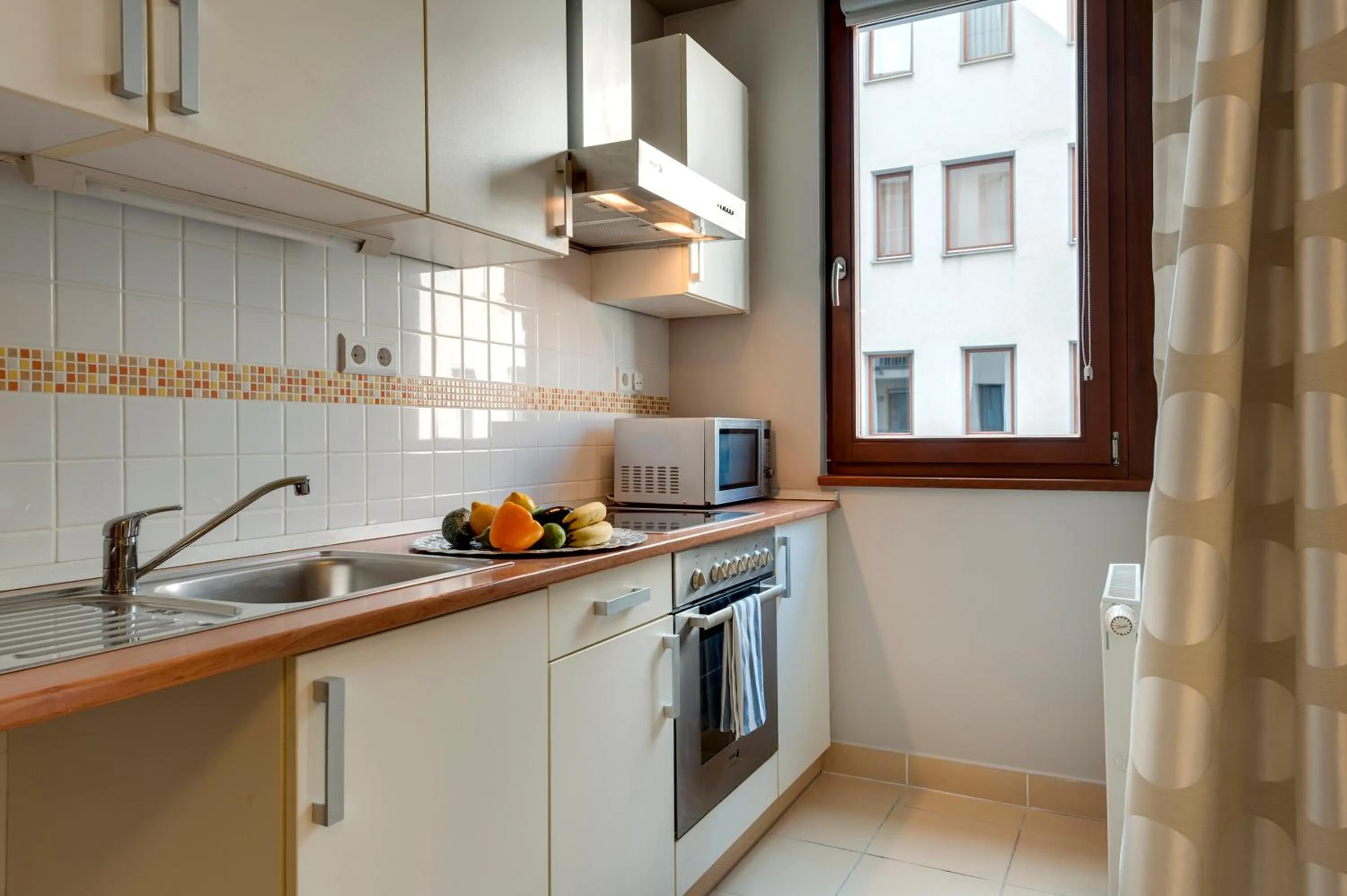 kitchen in Central Passage Apartments by Vagabond Downtown