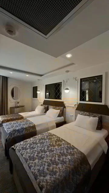 Bed in AYDINLI HOTEL