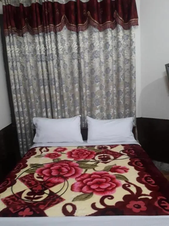 Bed in Hotel Deewan-E-Aziz Internationa