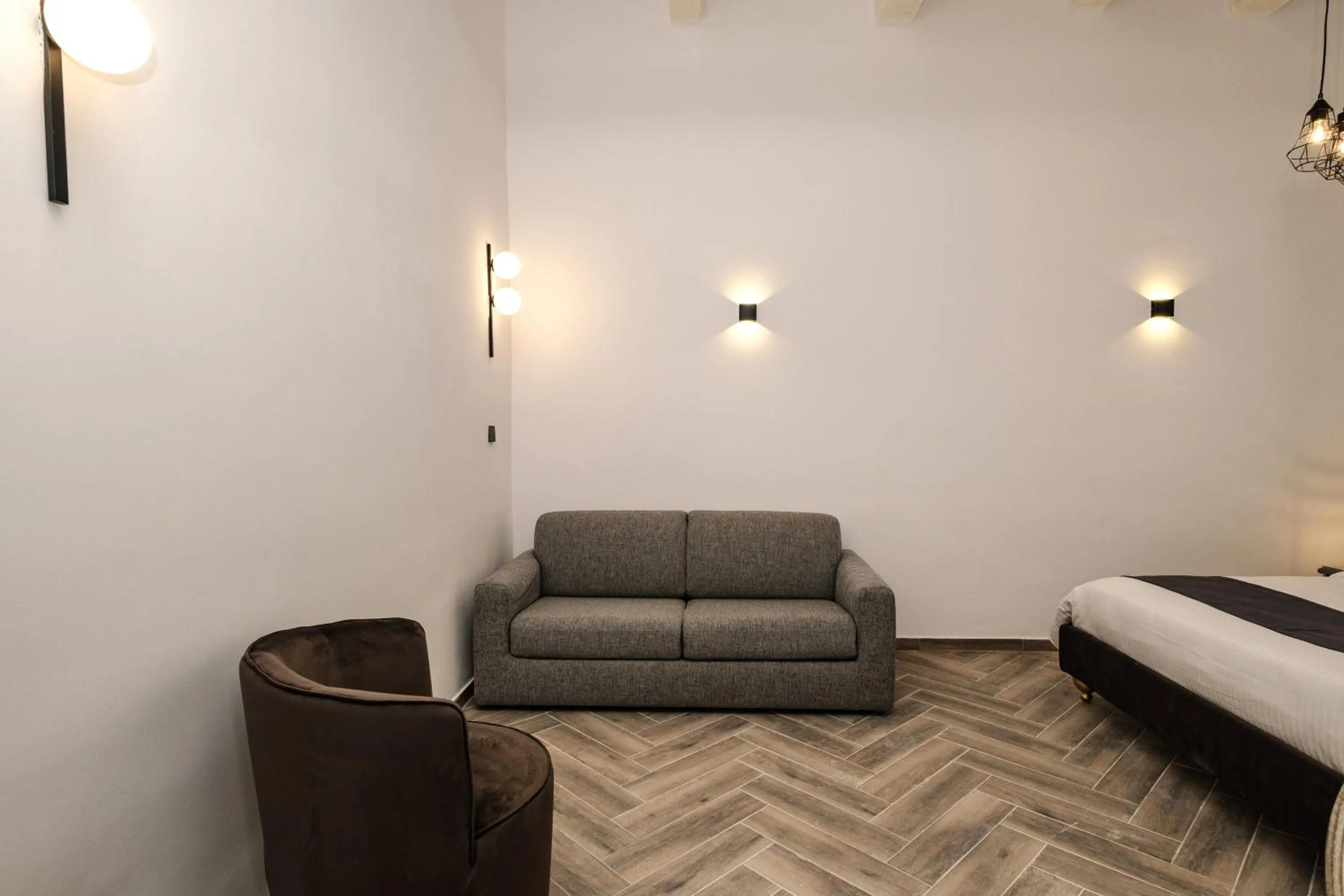 Seating area, Bed in Casa Reale Boutique Hotel