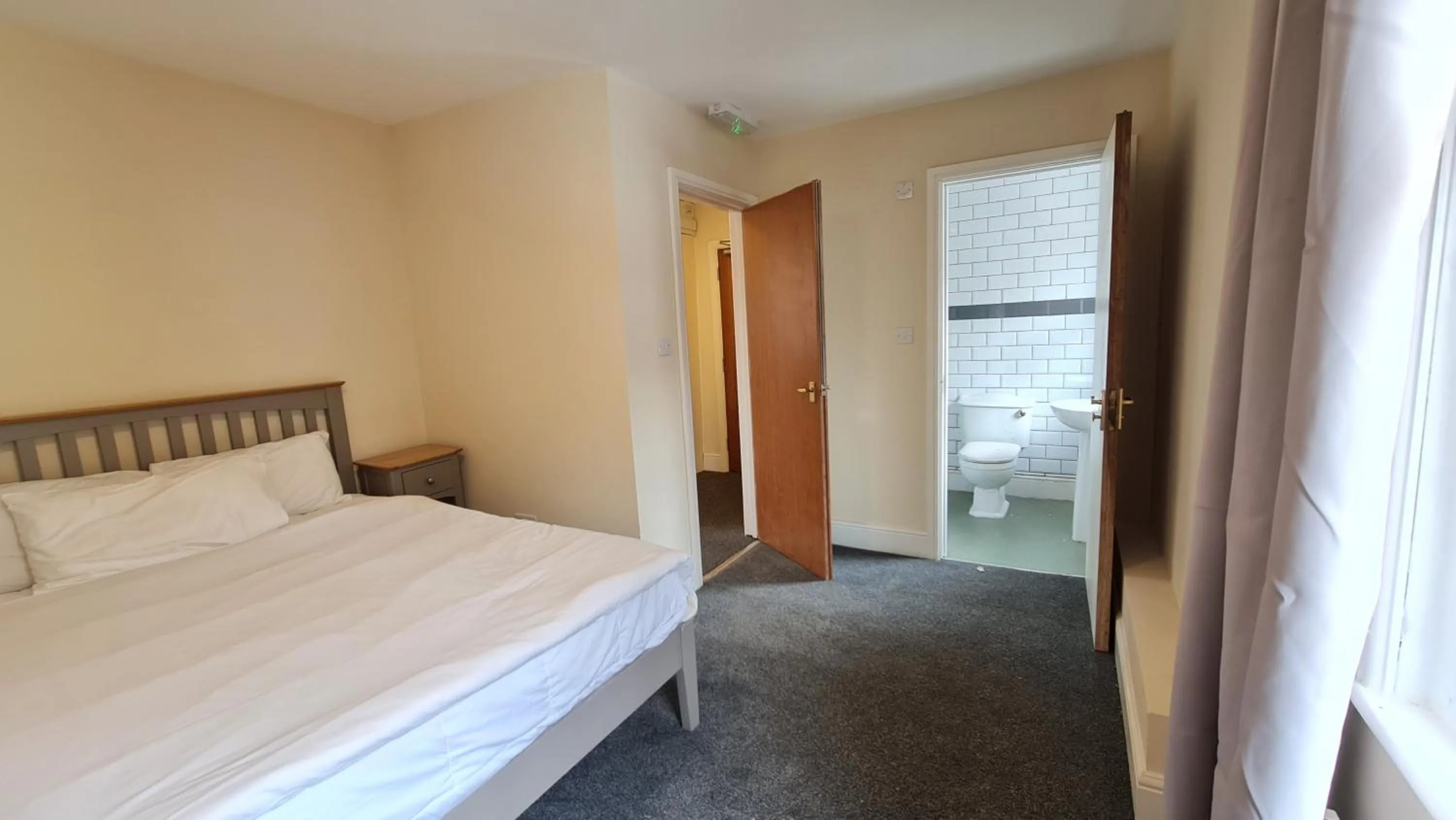 Bedroom, Bed in Grace Apartments - Living Rock