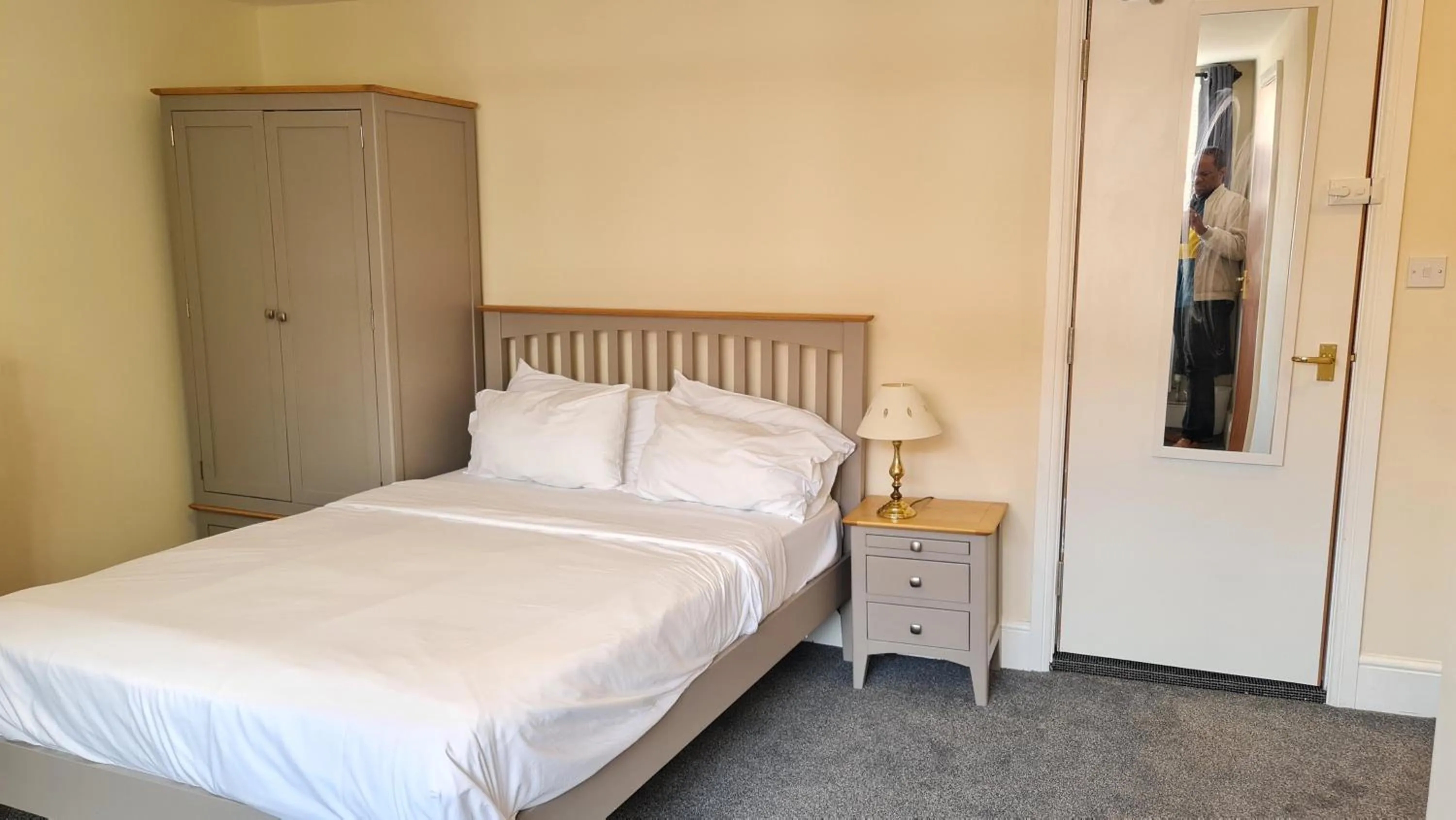 Bedroom, Bed in Grace Apartments - Living Rock