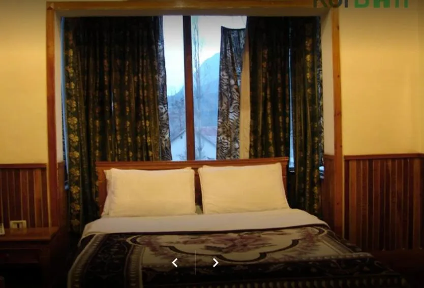 Bed in Greens Hotel Kalam