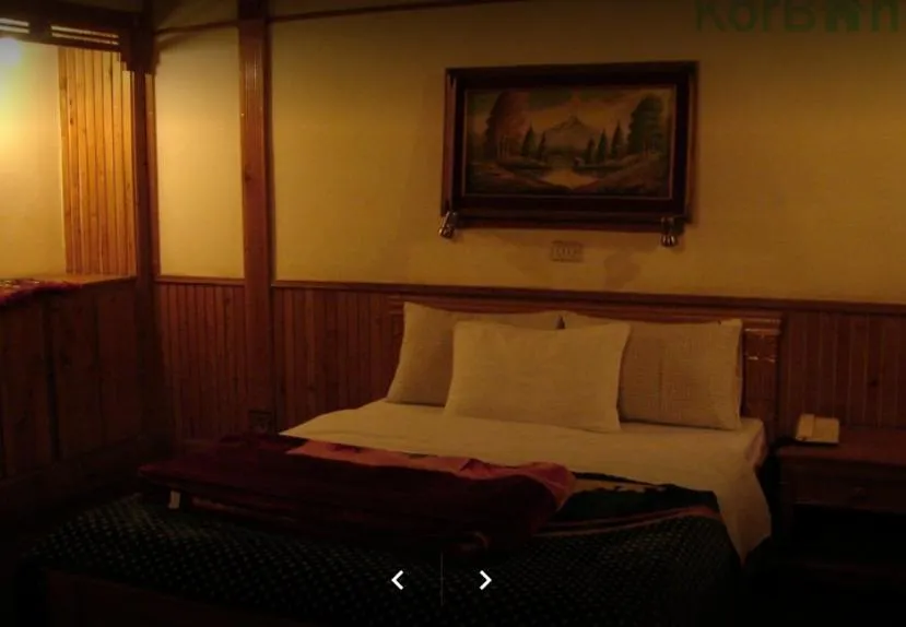 Bed in Greens Hotel Kalam
