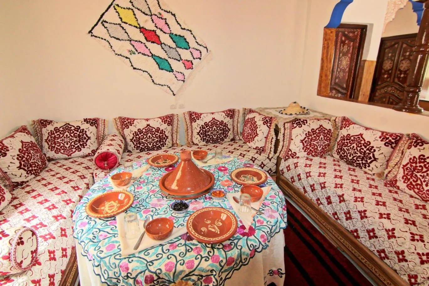 Dining area, Bed in Jnane Karma