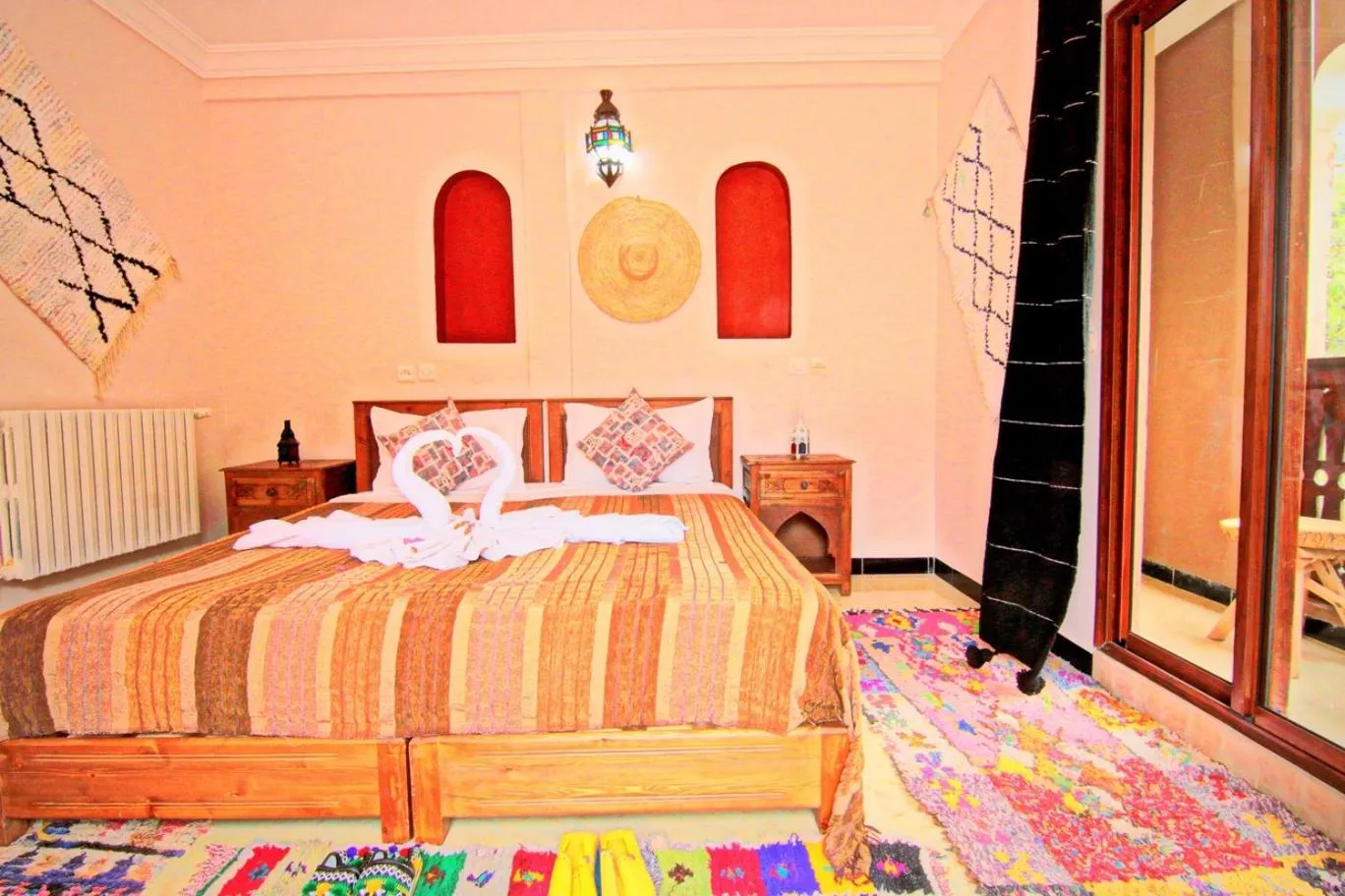 Photo of the whole room, Bed in Jnane Karma