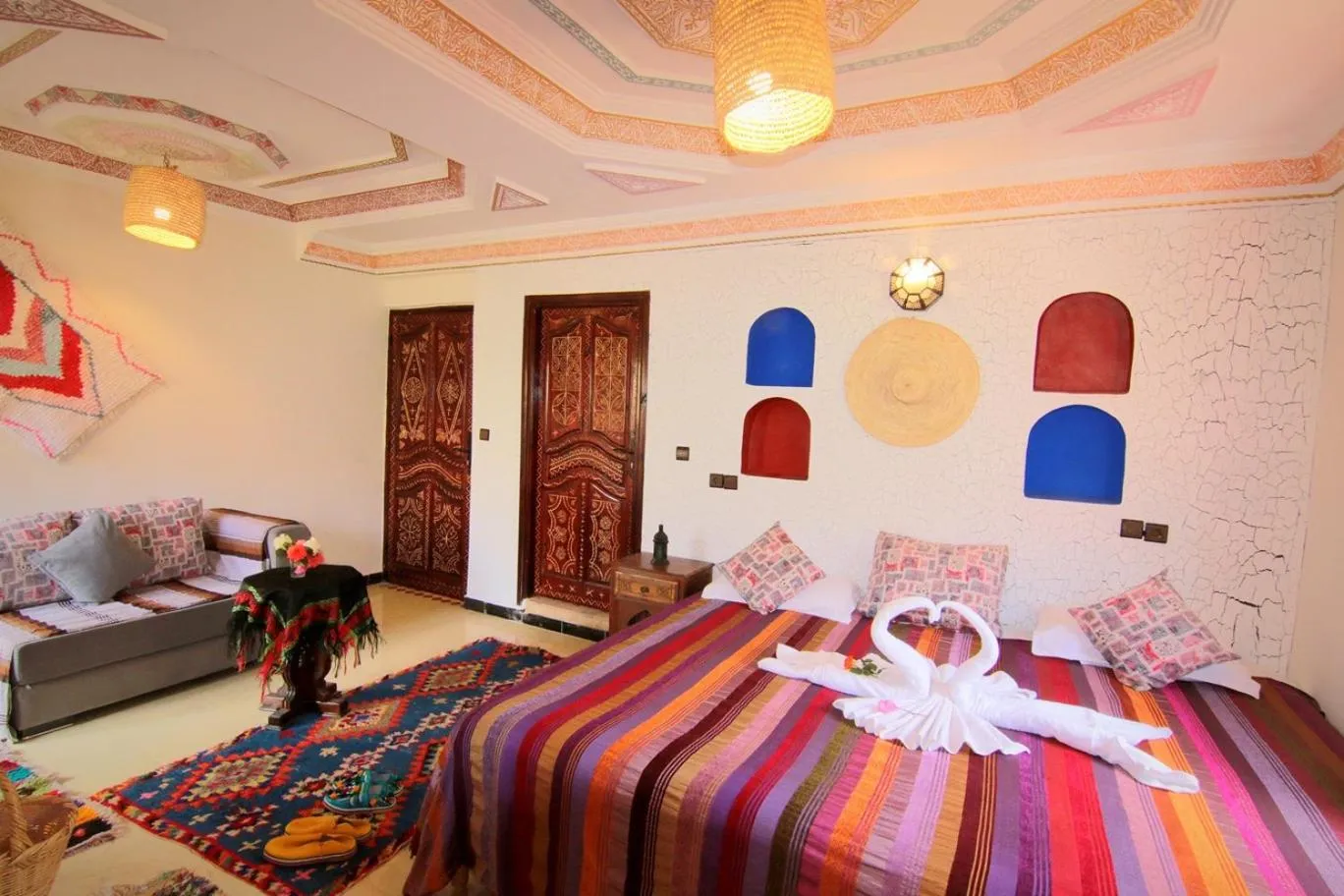 Photo of the whole room, Bed in Jnane Karma