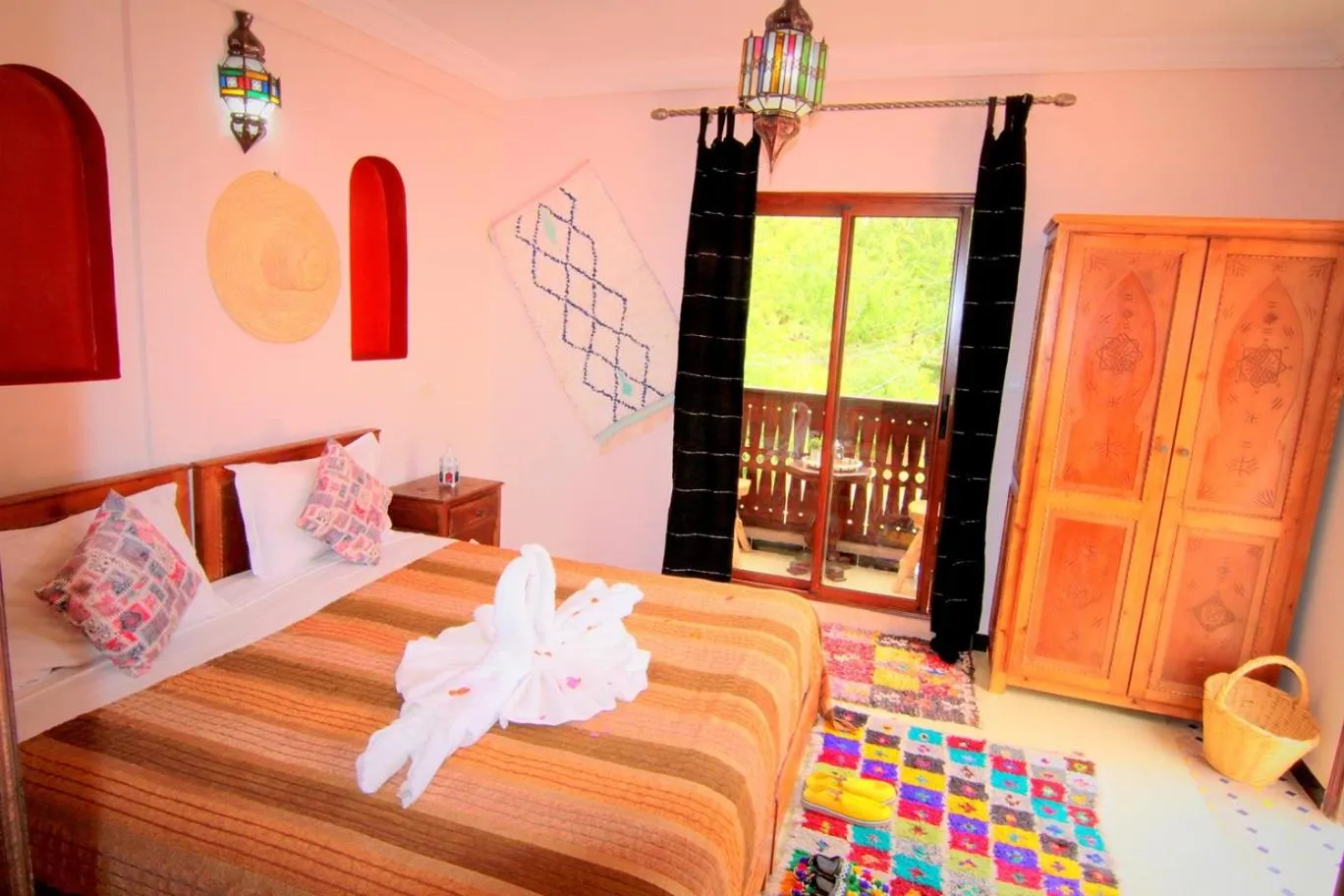 Photo of the whole room, Bed in Jnane Karma