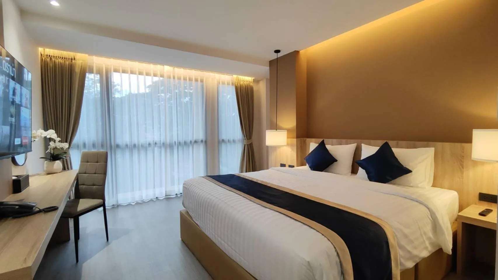 Bed in Hi Chiangmai Hotel