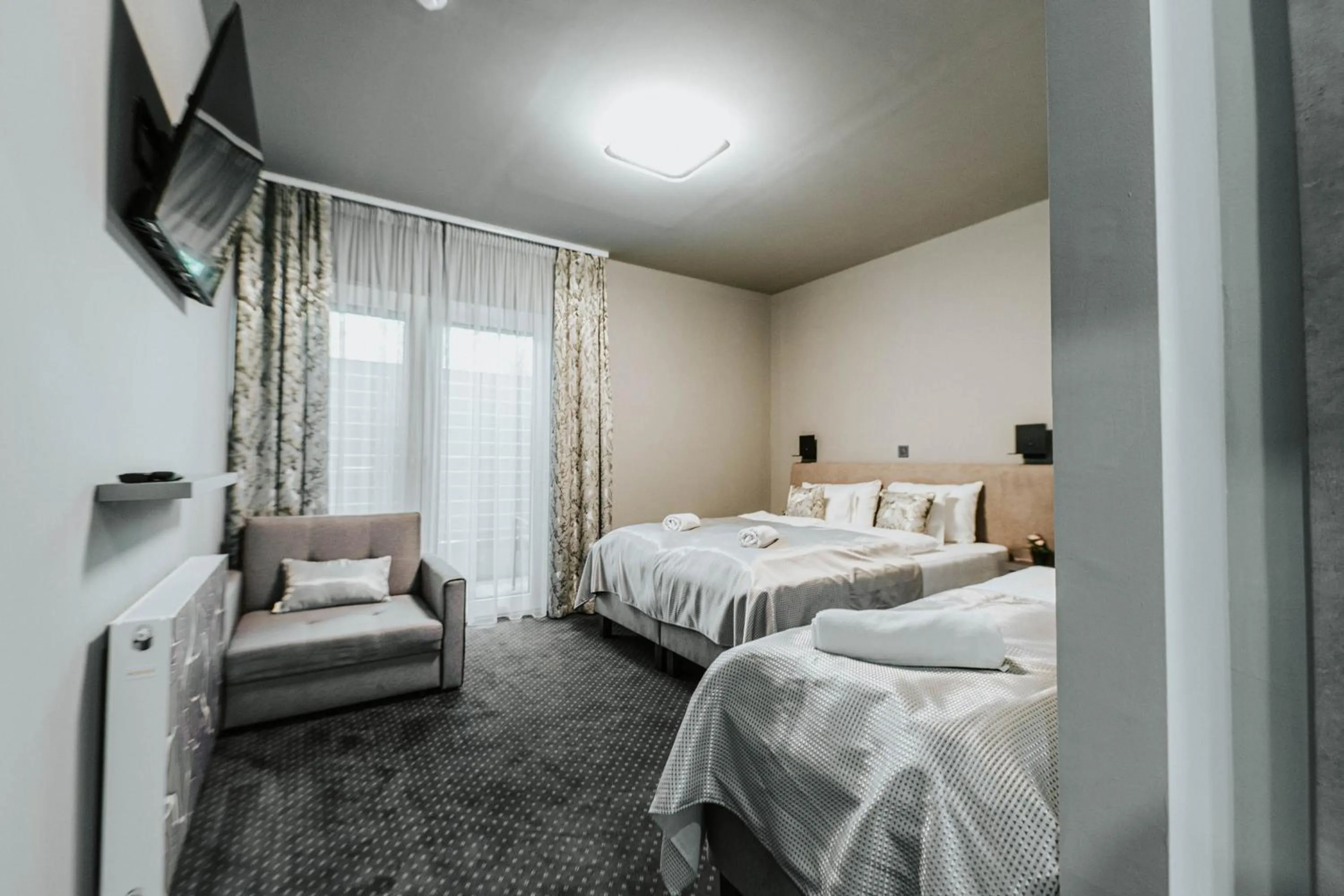 Photo of the whole room, Bed in Arena Deluxe & Spa