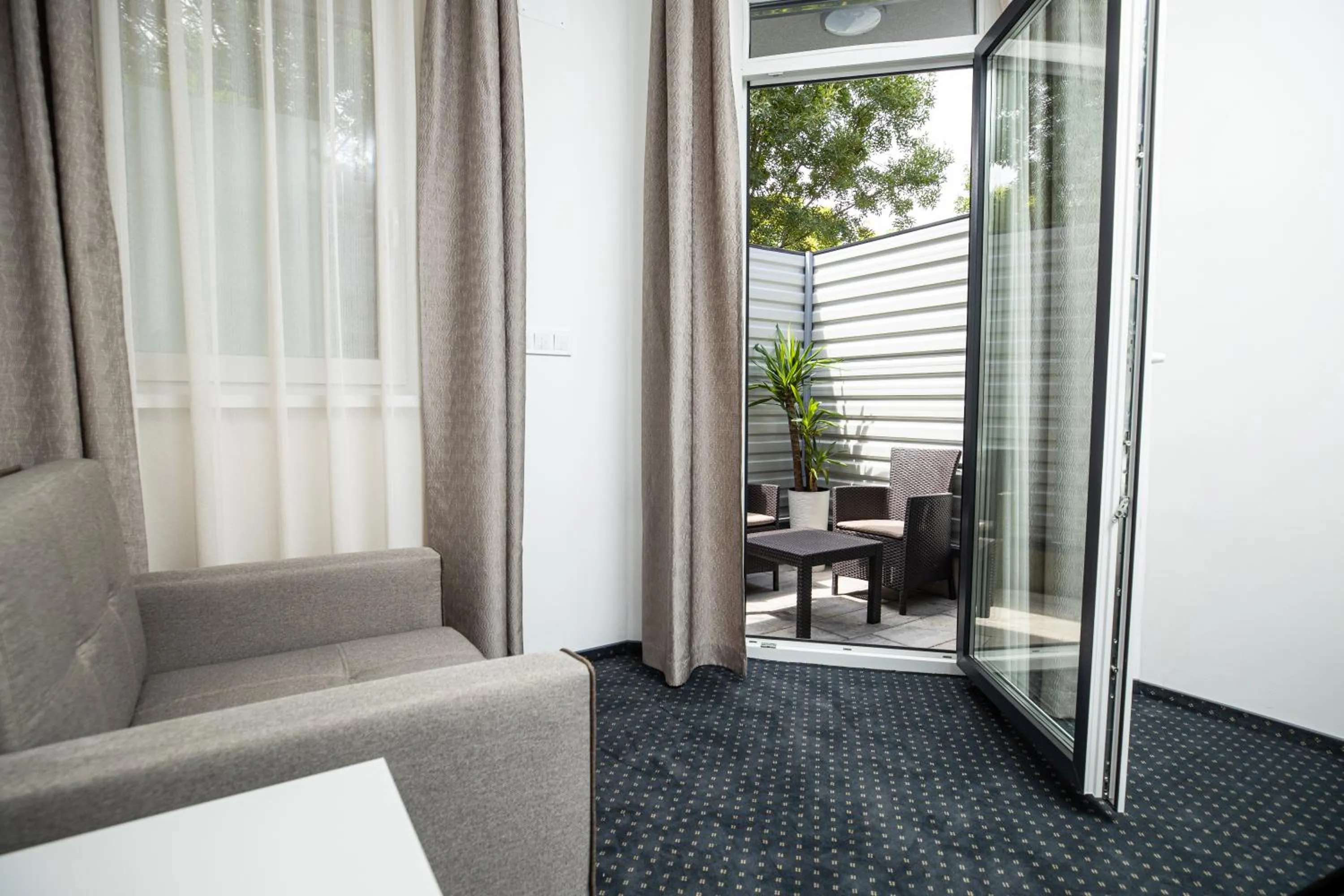 Seating area in Arena Deluxe & Spa