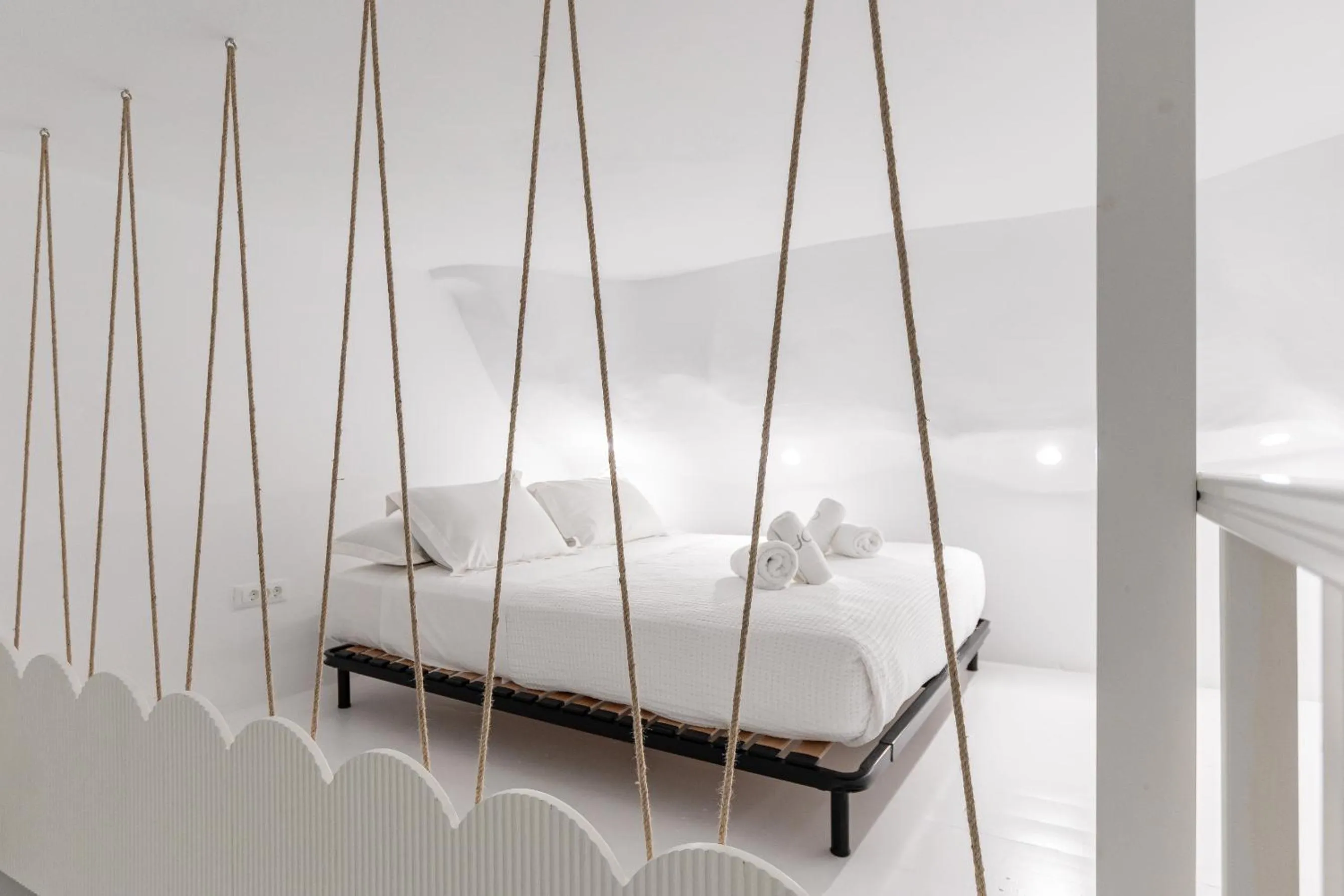 Bed in Majo Suites Hotel