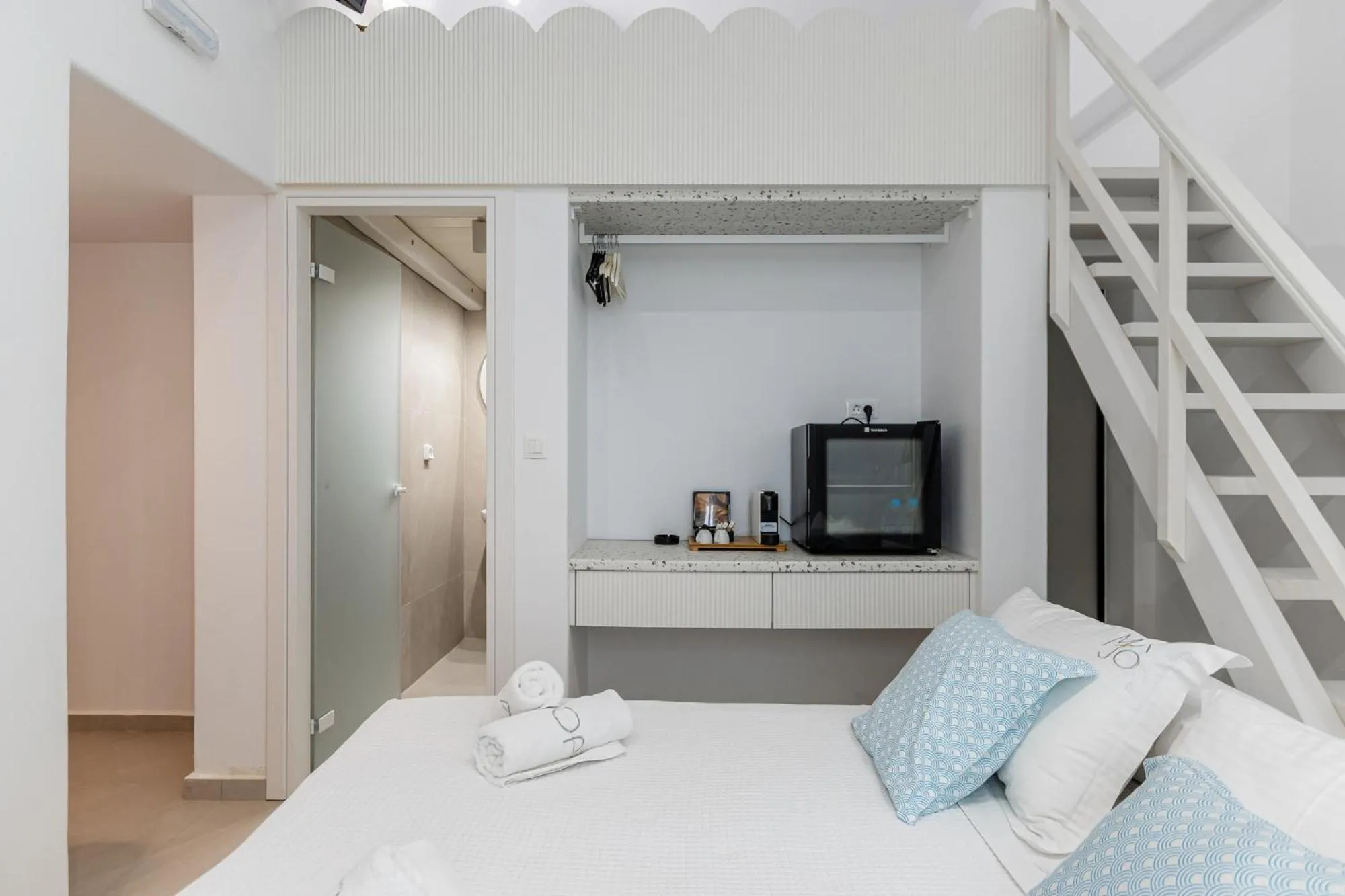 Bed in Majo Suites Hotel