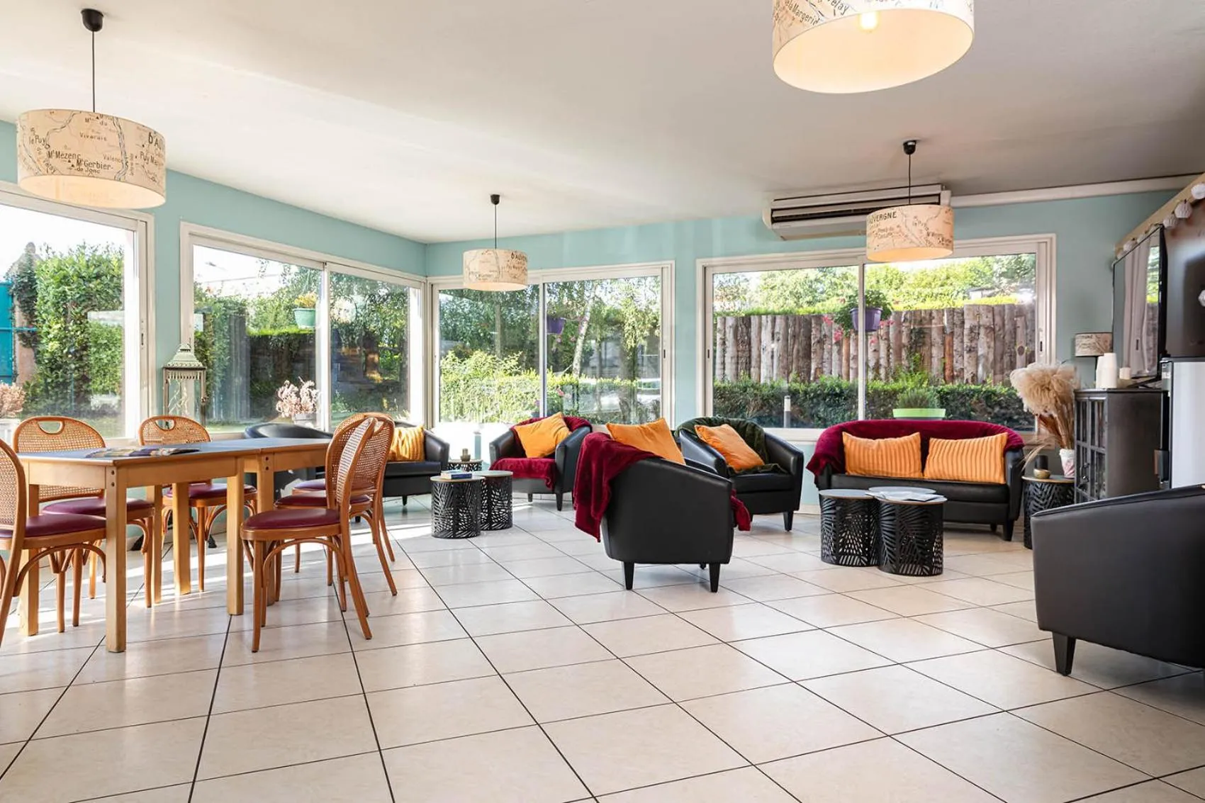 Communal lounge/ TV room in Deltour Hotel Le Puy En Velay