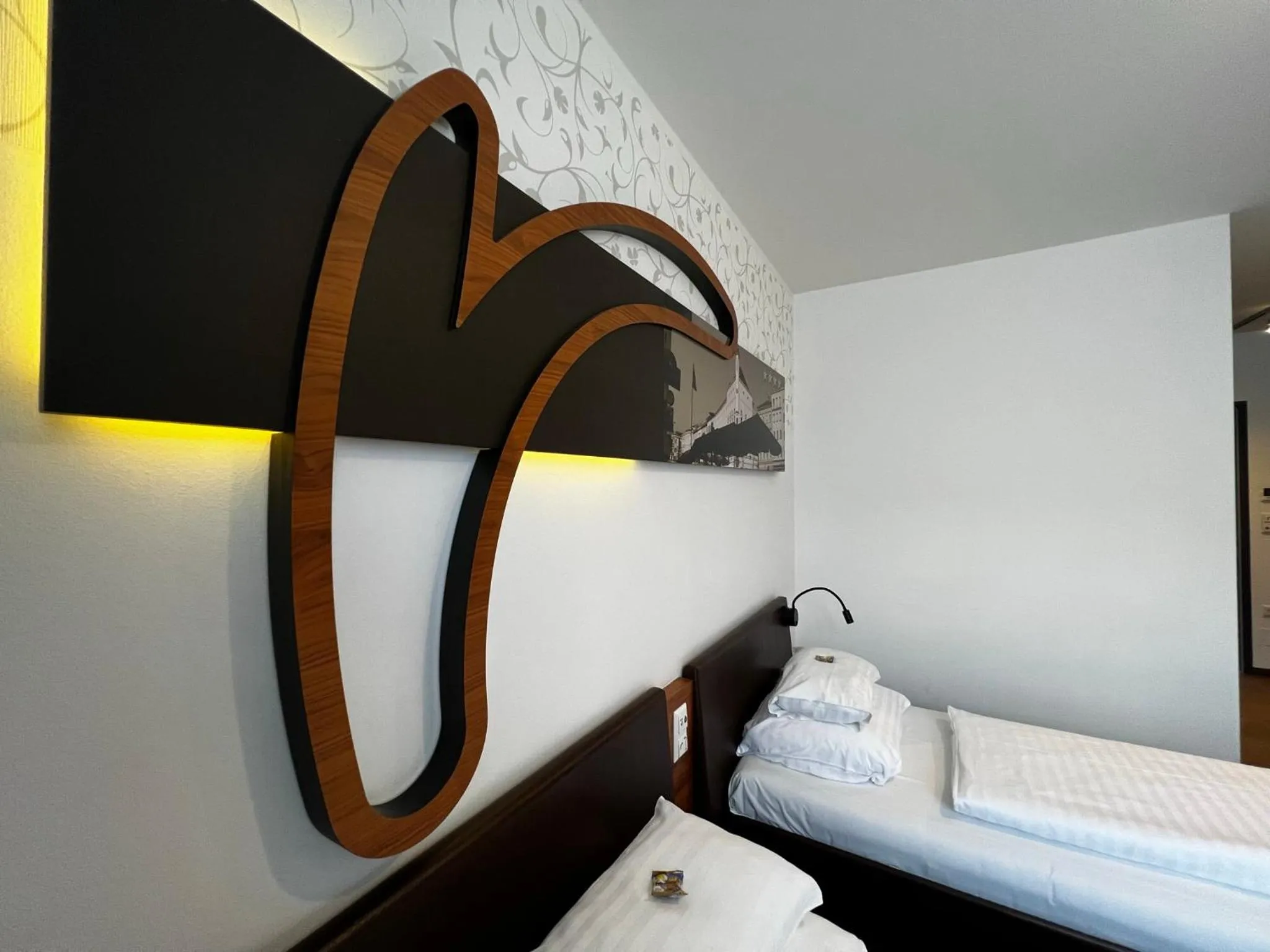 Photo of the whole room, Bed in H+ Hotel Ried