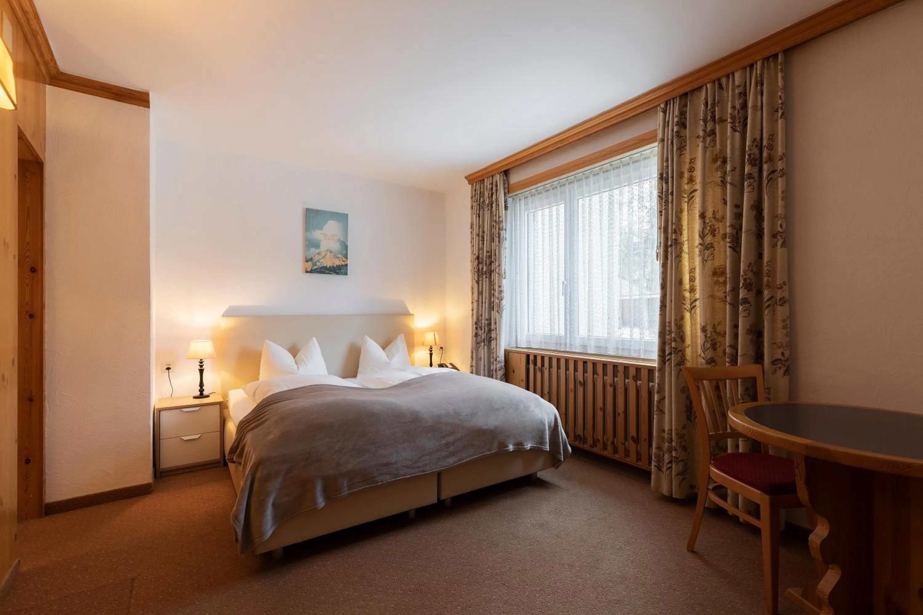 Bed in Hotel Europa Suites St Moritz