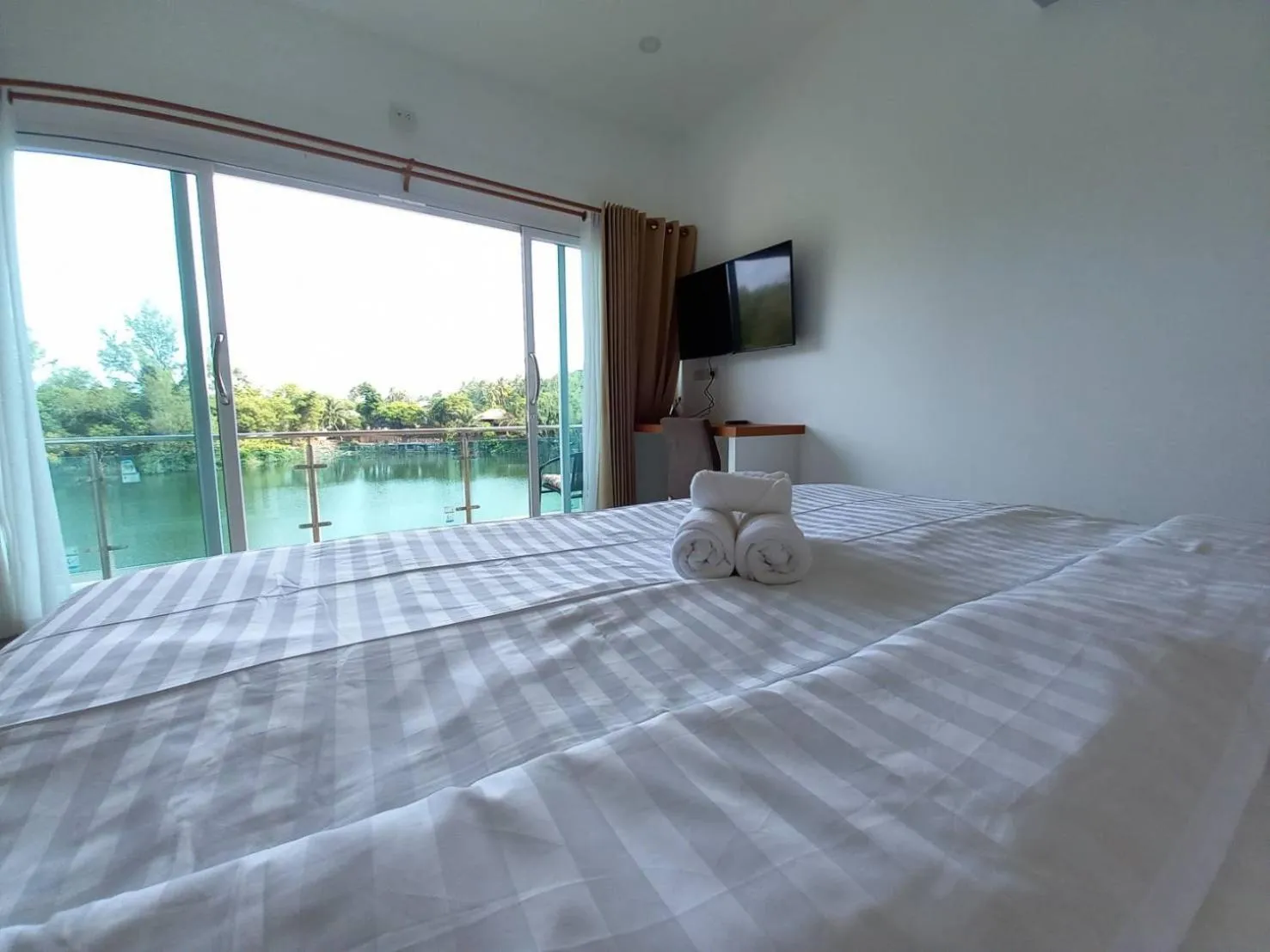 TV and multimedia, Bed in Pure Laguna Residence by Nice Sea Resort