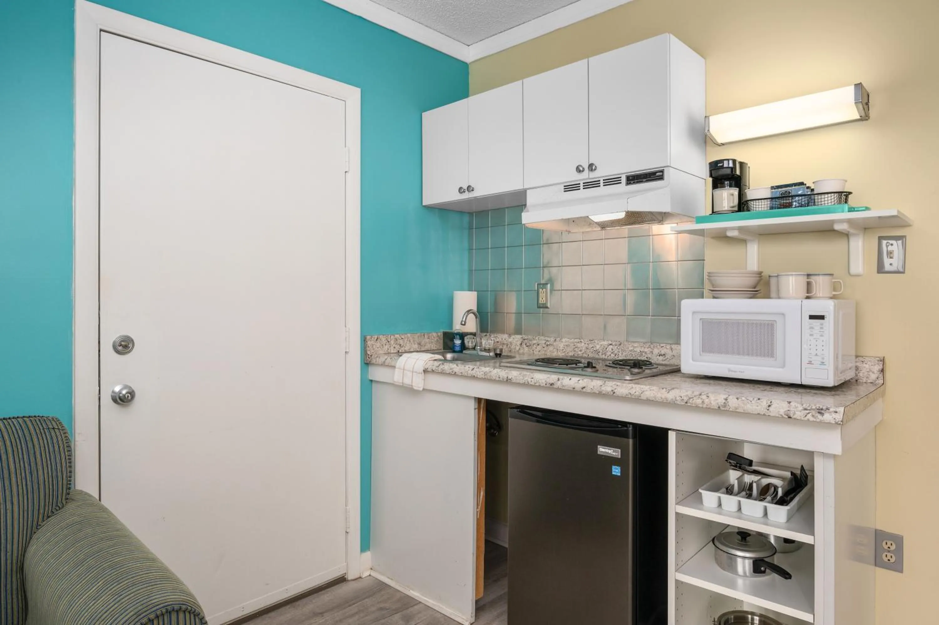 Kitchen or kitchenette in Cayman Suites Hotel