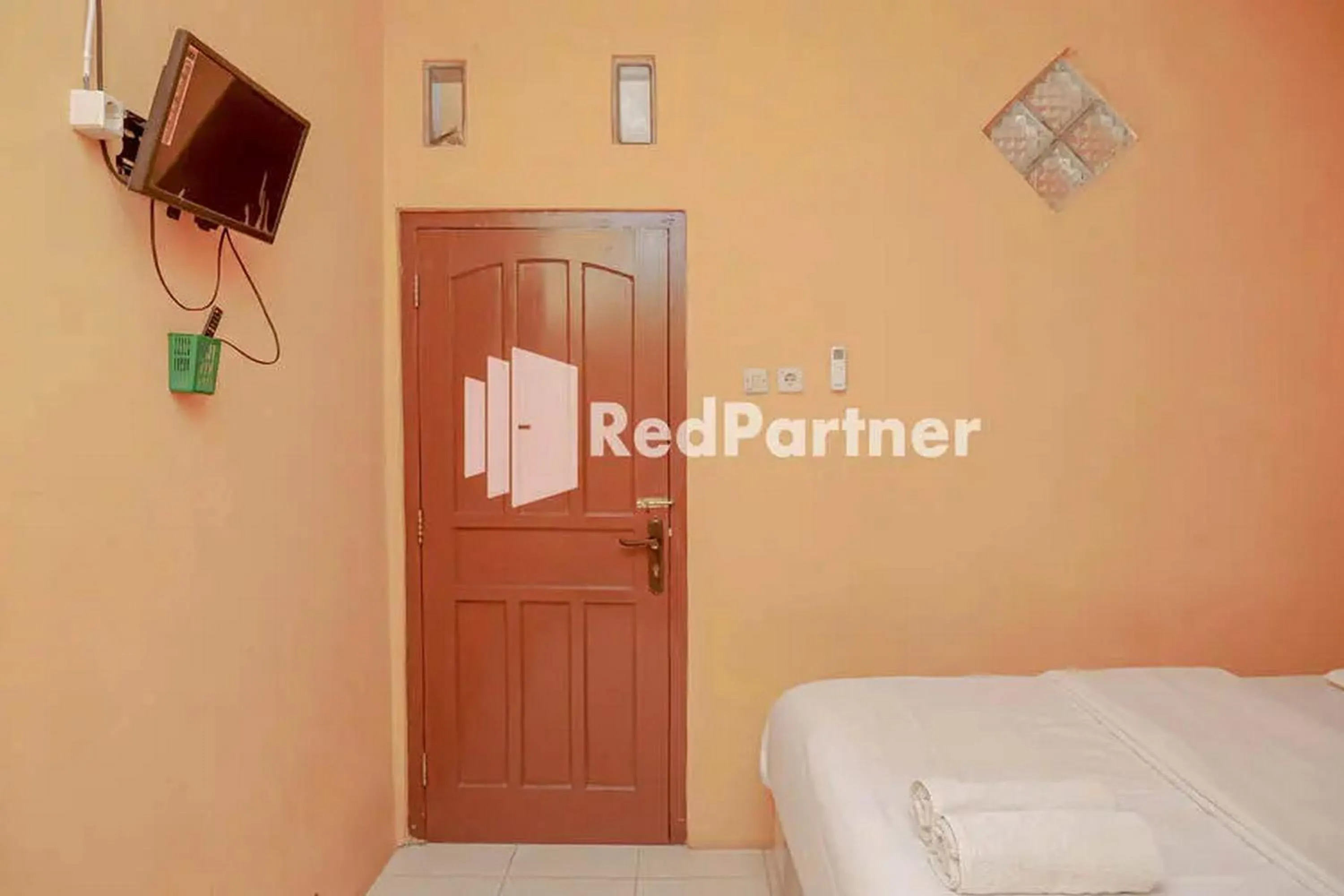 Bed in Pondok Damai Guest House Syariah Mitra RedDoorz