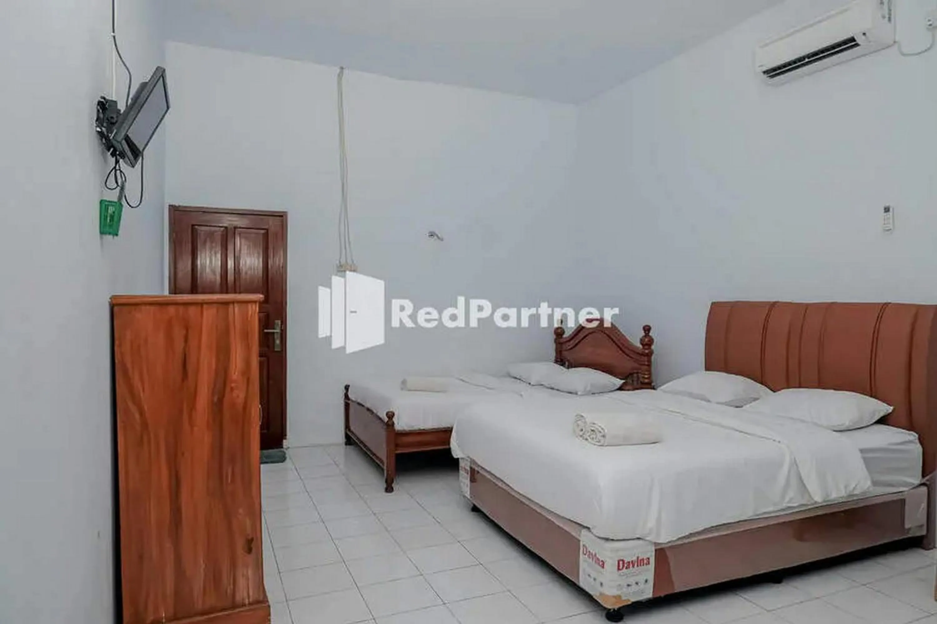 Bed in Pondok Damai Guest House Syariah Mitra RedDoorz