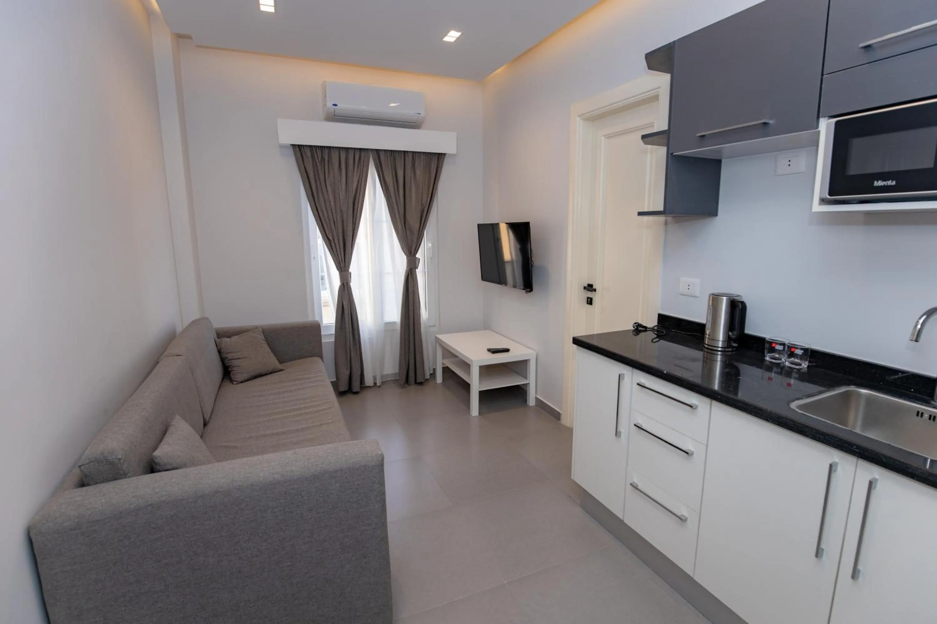 Communal lounge/ TV room in Villa 55