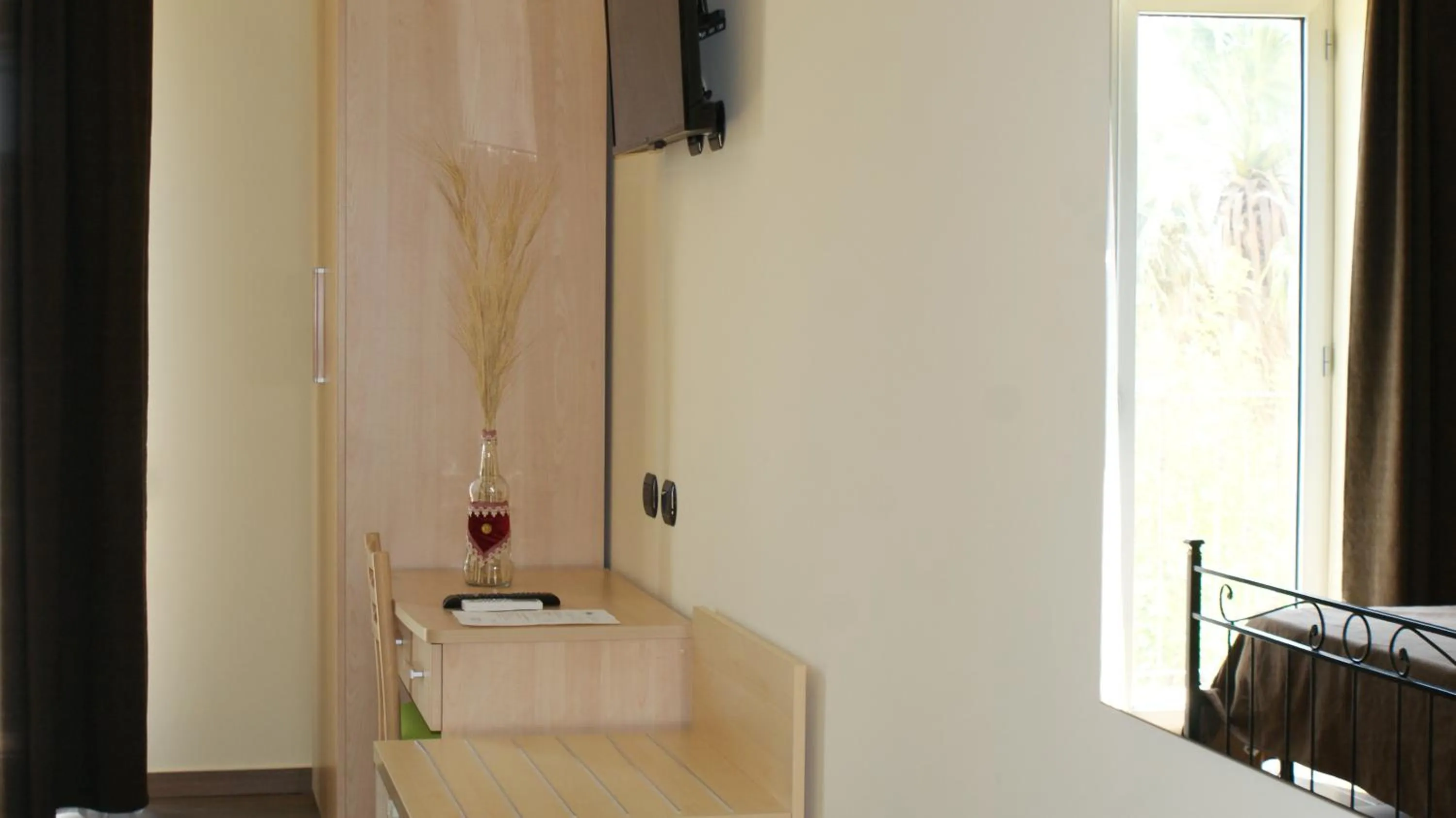 TV and multimedia, Bed in Mimí Hotel