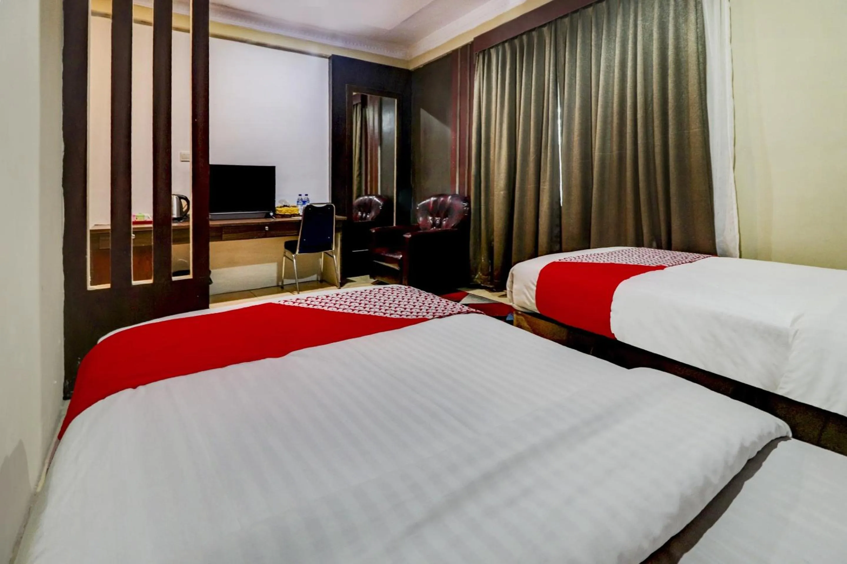 Bedroom in Collection O 90564 Hotel Merangin Syariah