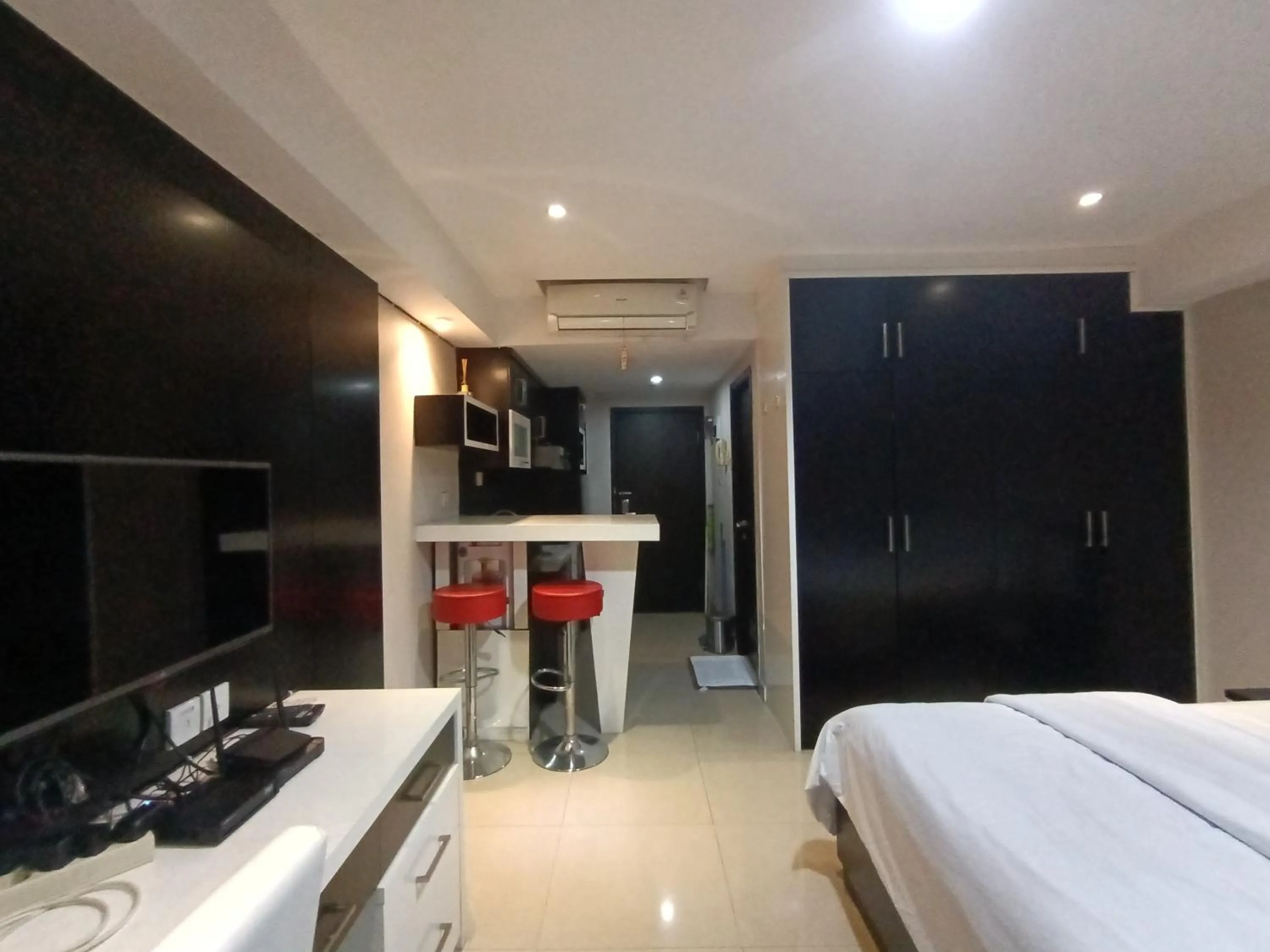 Photo of the whole room, Bed in Cozy Tamansari Hive Cawang by Bonzela Property