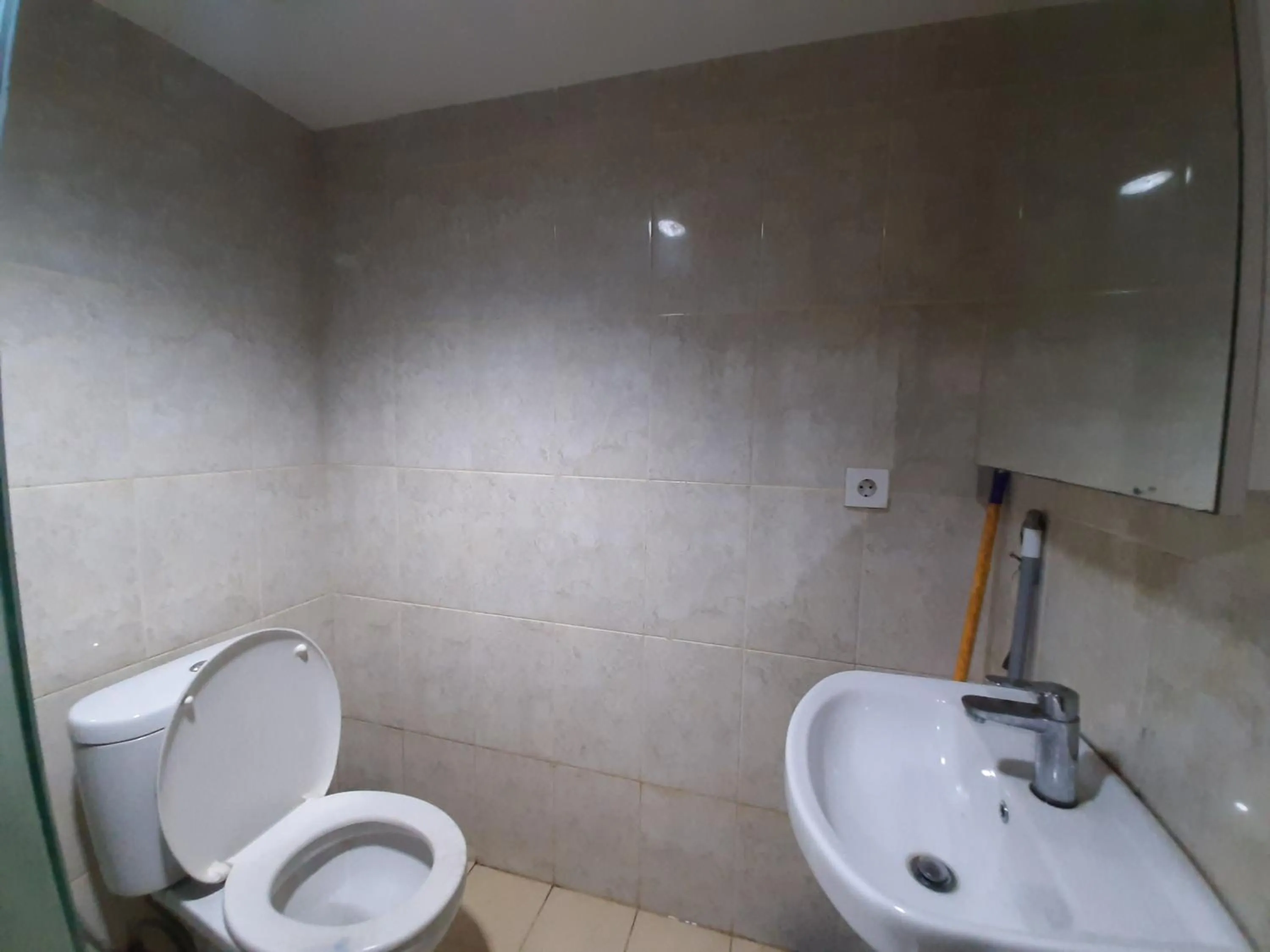 Bathroom in Cozy Tamansari Hive Cawang by Bonzela Property