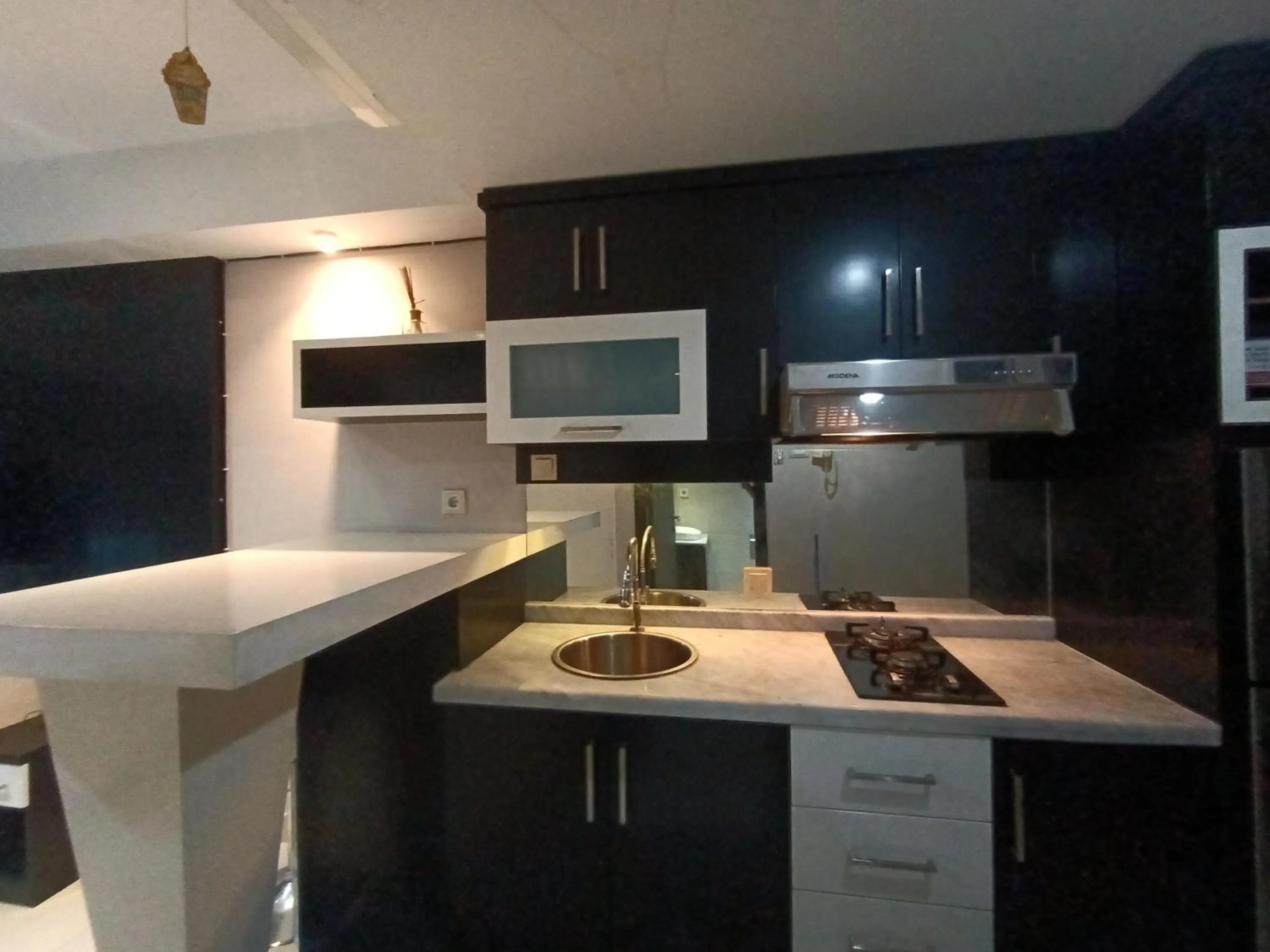 Kitchen or kitchenette in Cozy Tamansari Hive Cawang by Bonzela Property