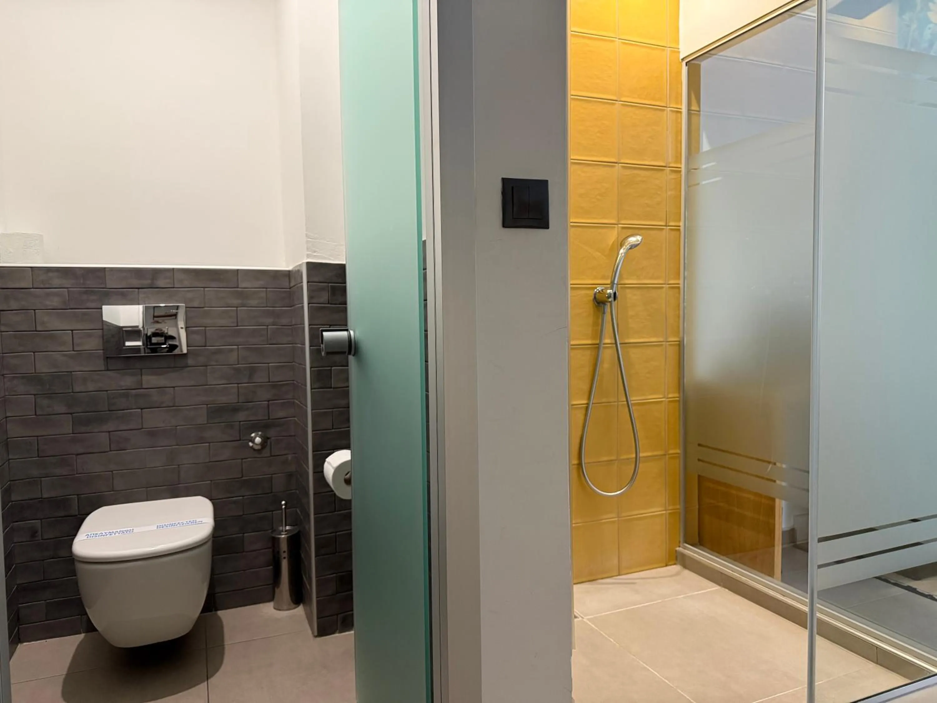 Shower in The Maroon Bottle Luxury Suites