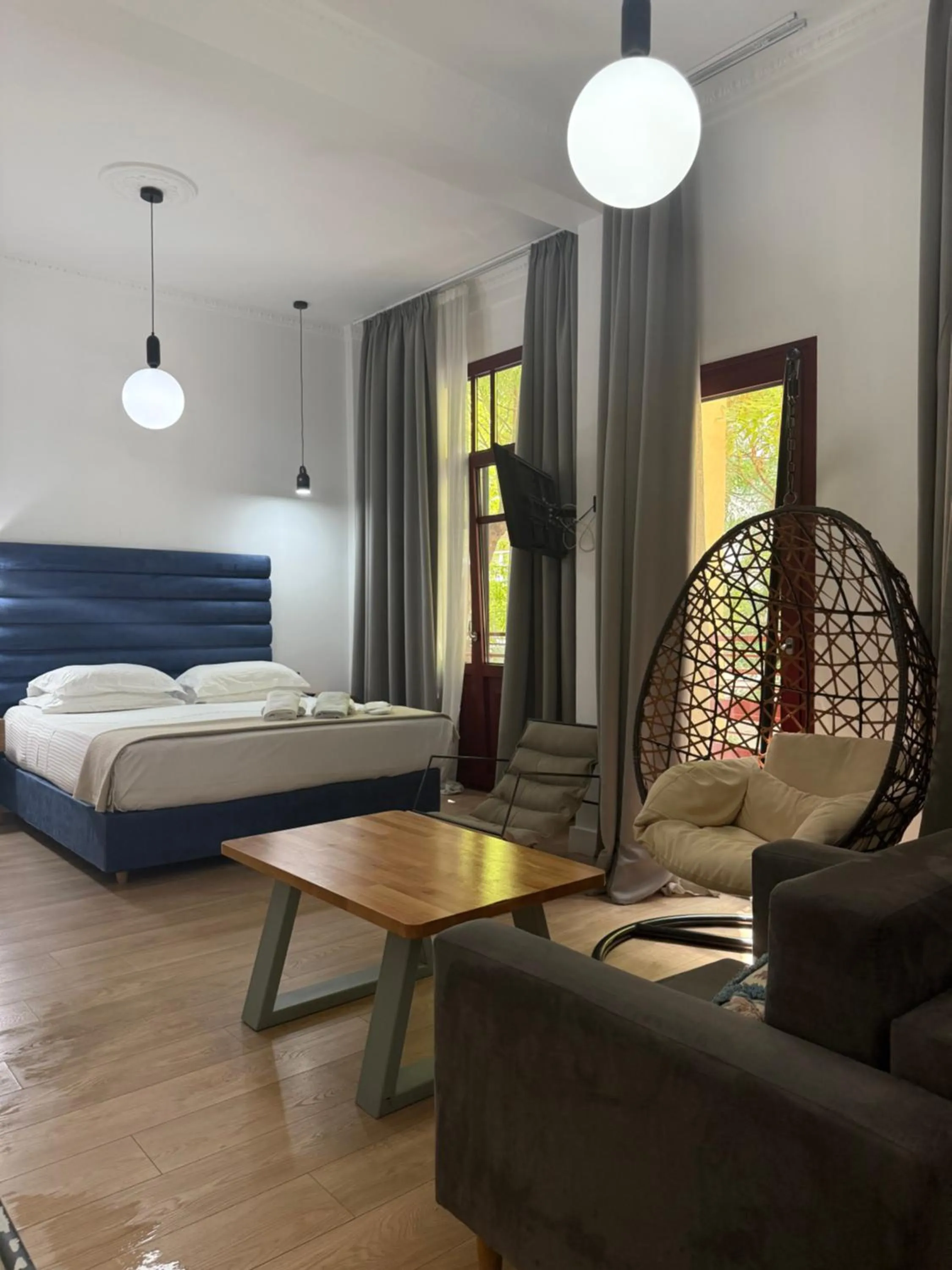 Bed in The Maroon Bottle Luxury Suites