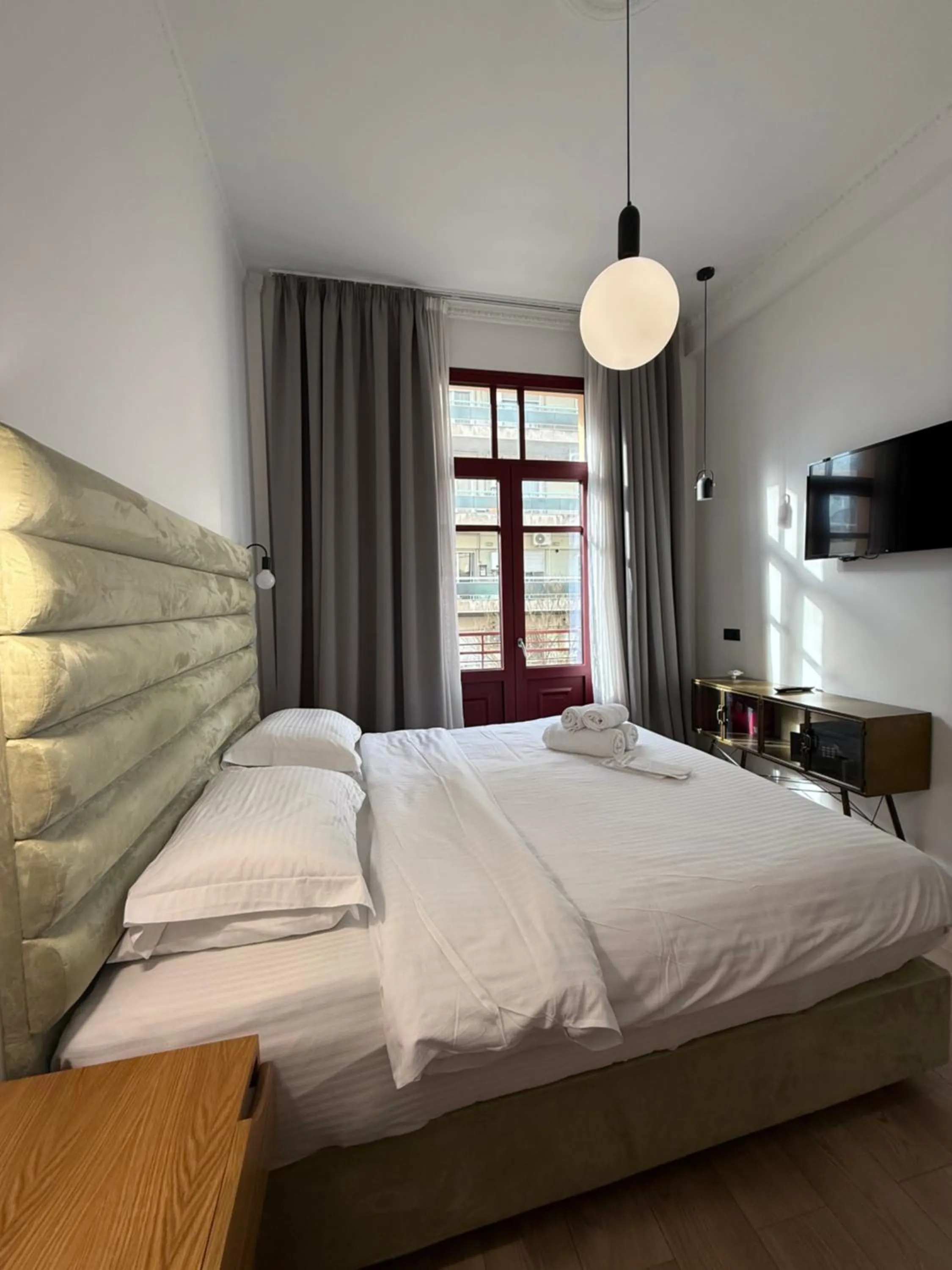 Bed in The Maroon Bottle Luxury Suites