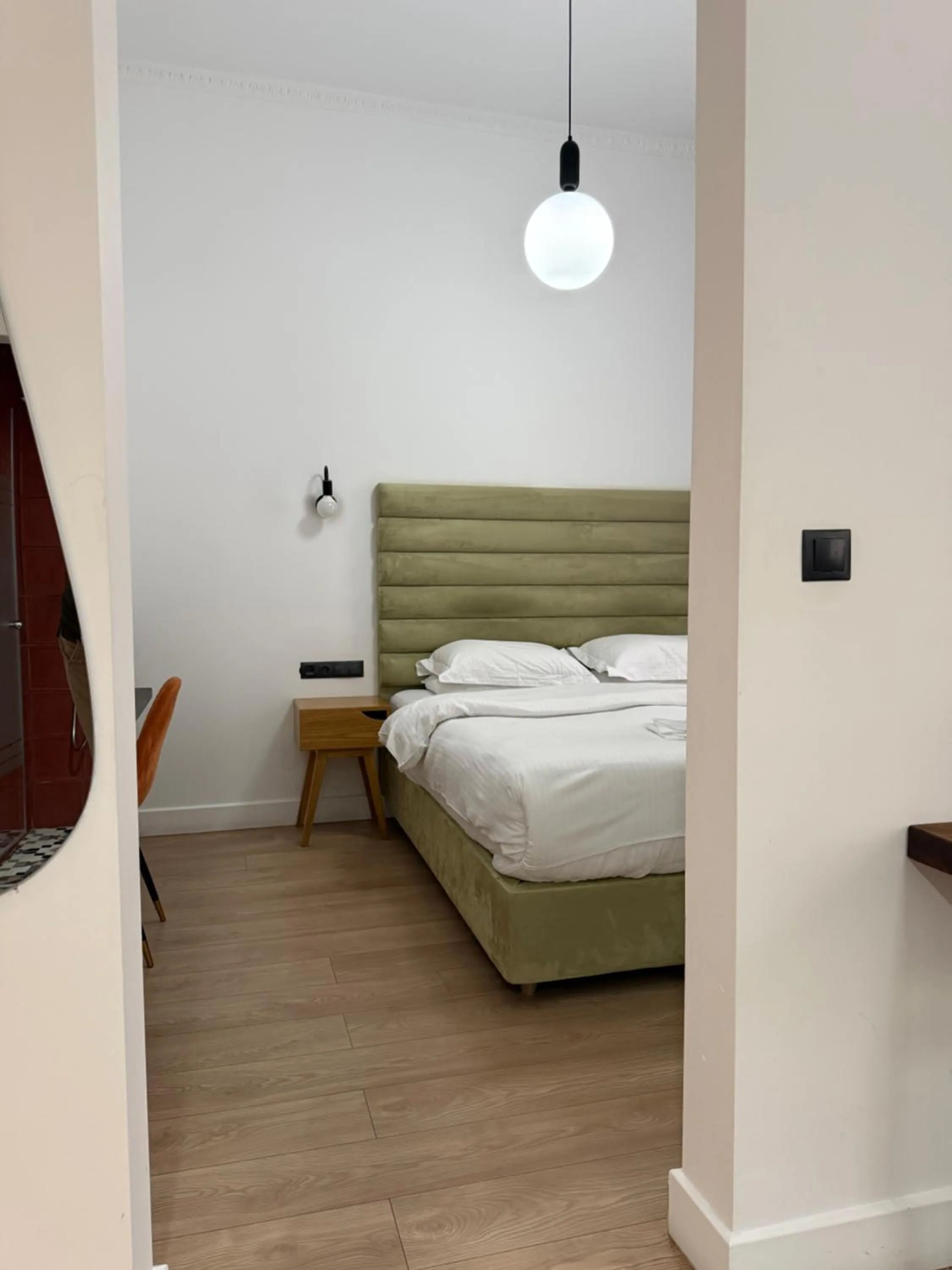 Bed in The Maroon Bottle Luxury Suites