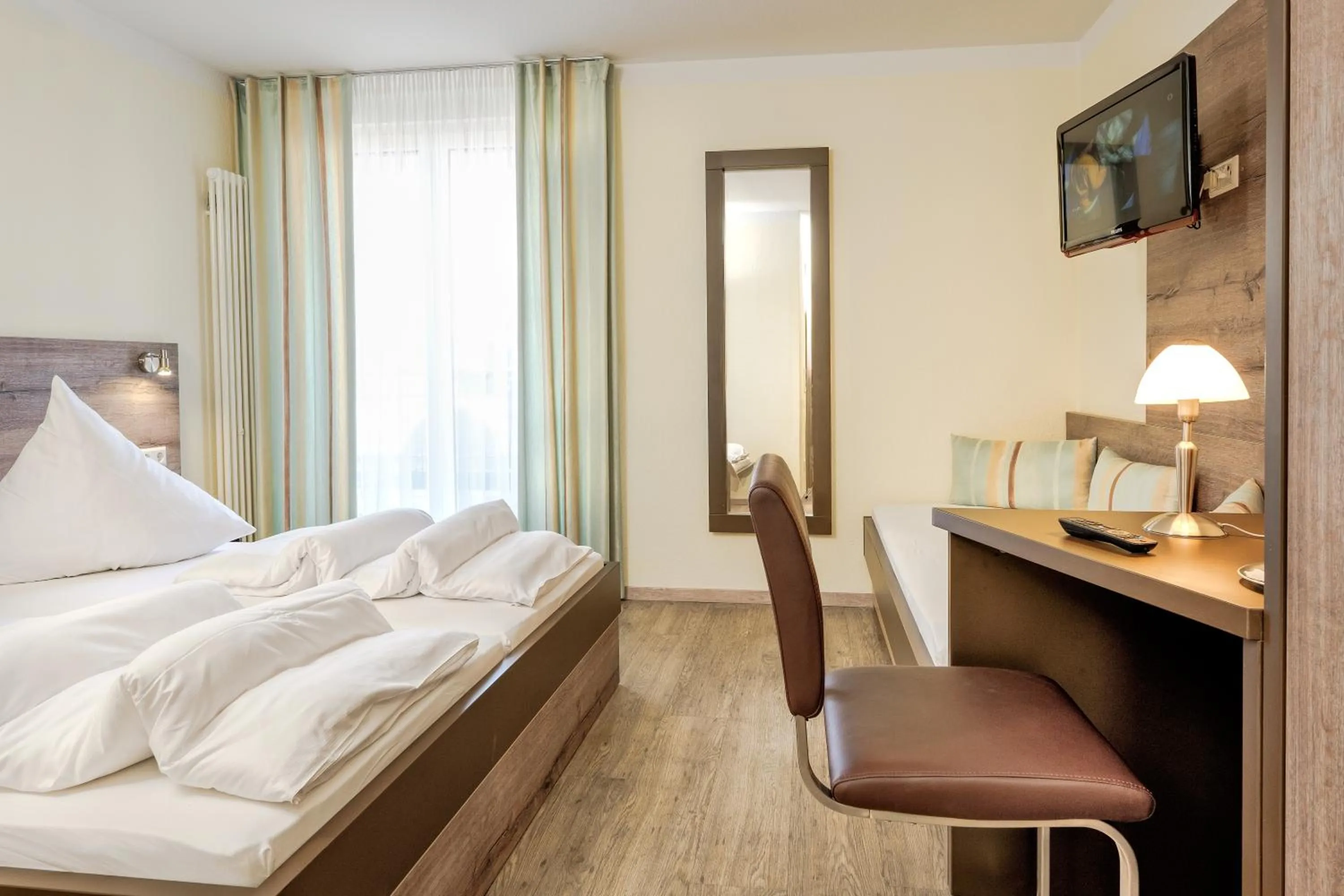 Photo of the whole room, Bed in Hotel Mythos