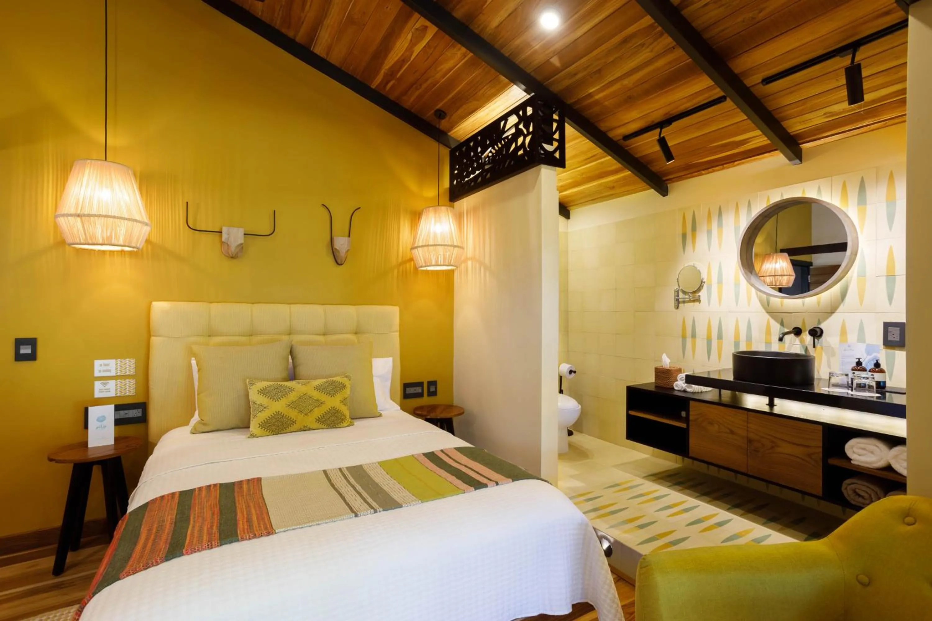 Bed in awā Beachfront Hotel